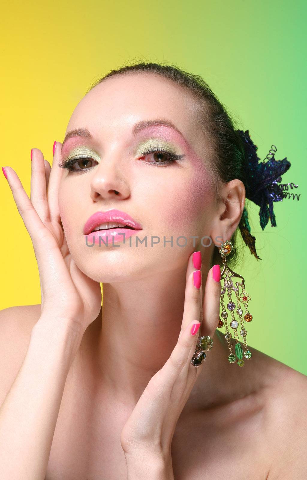 beautiful girl with make up on yellow-green background