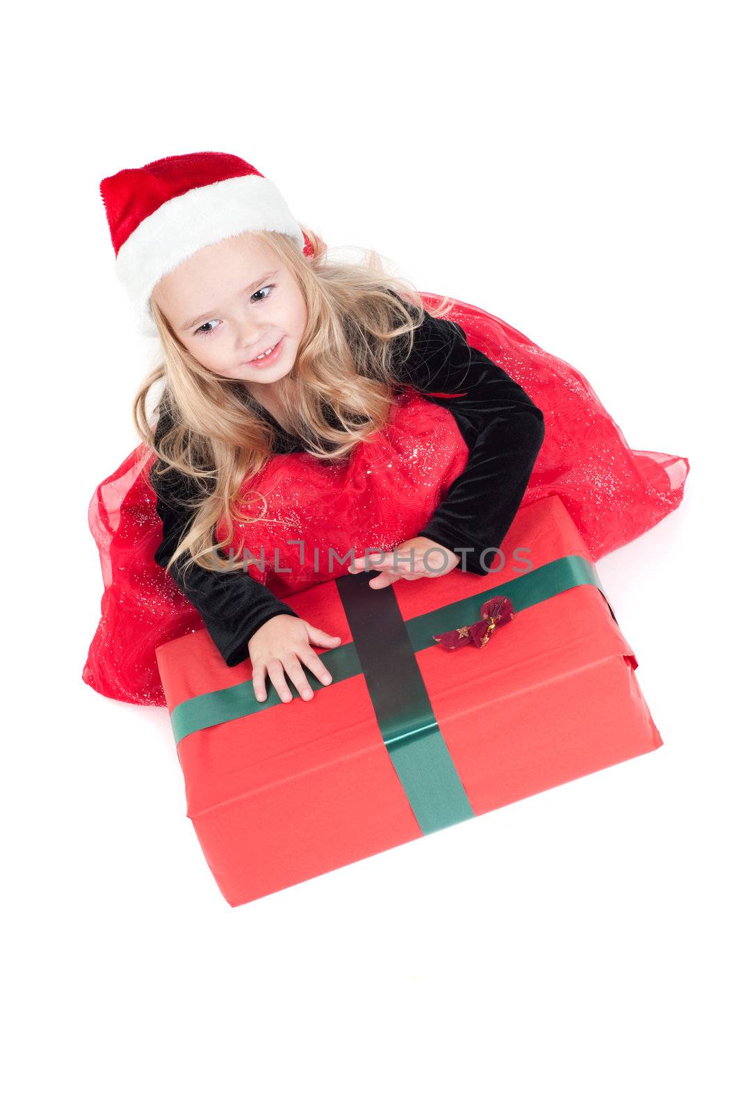 Beautiful baby girl dressed up for Christmas isolated in white