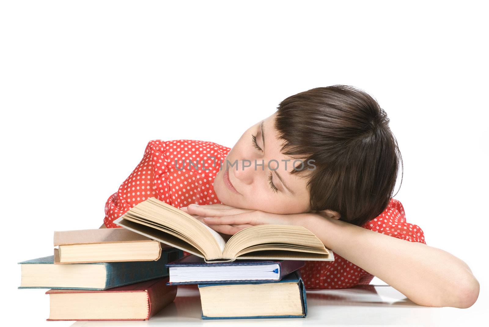 Young women sleep on the book, white background