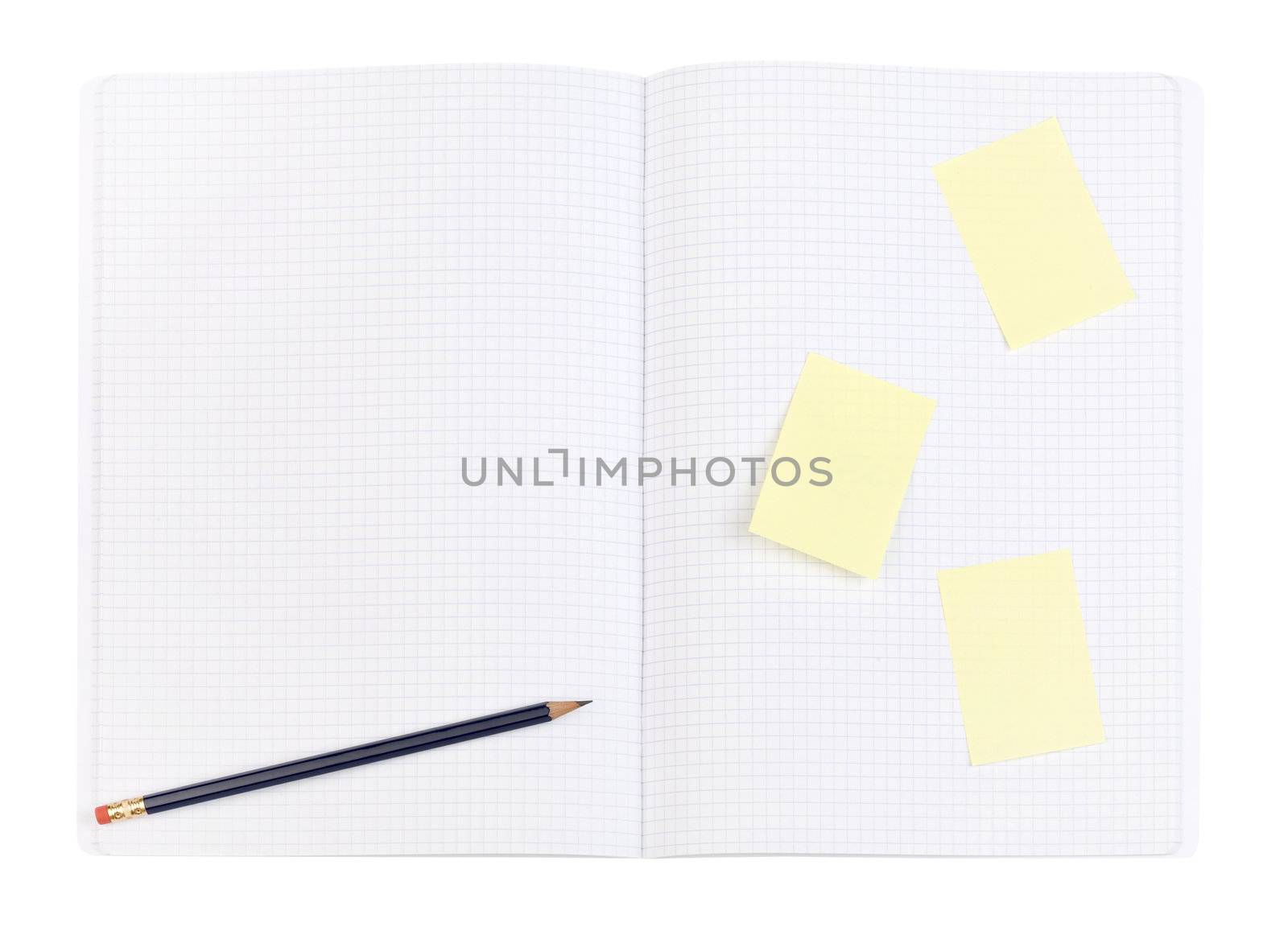 Blue pencil and yellow sticker on squared page. Pattern. Clipping path.