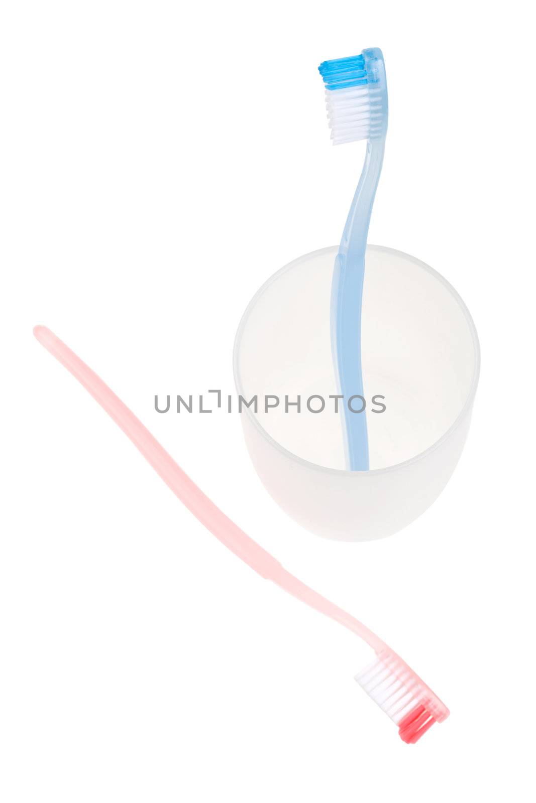 Colored toothbrush in glass. With clipping path.