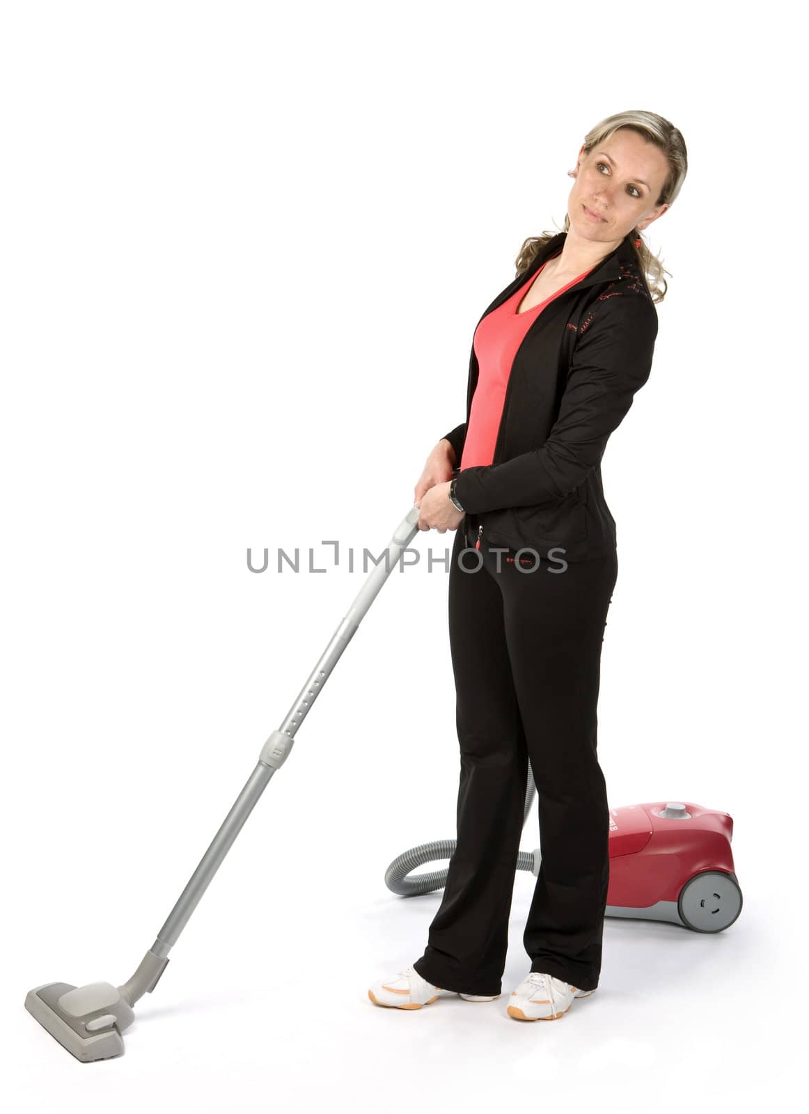 Young women with vacuum cleaner on white background