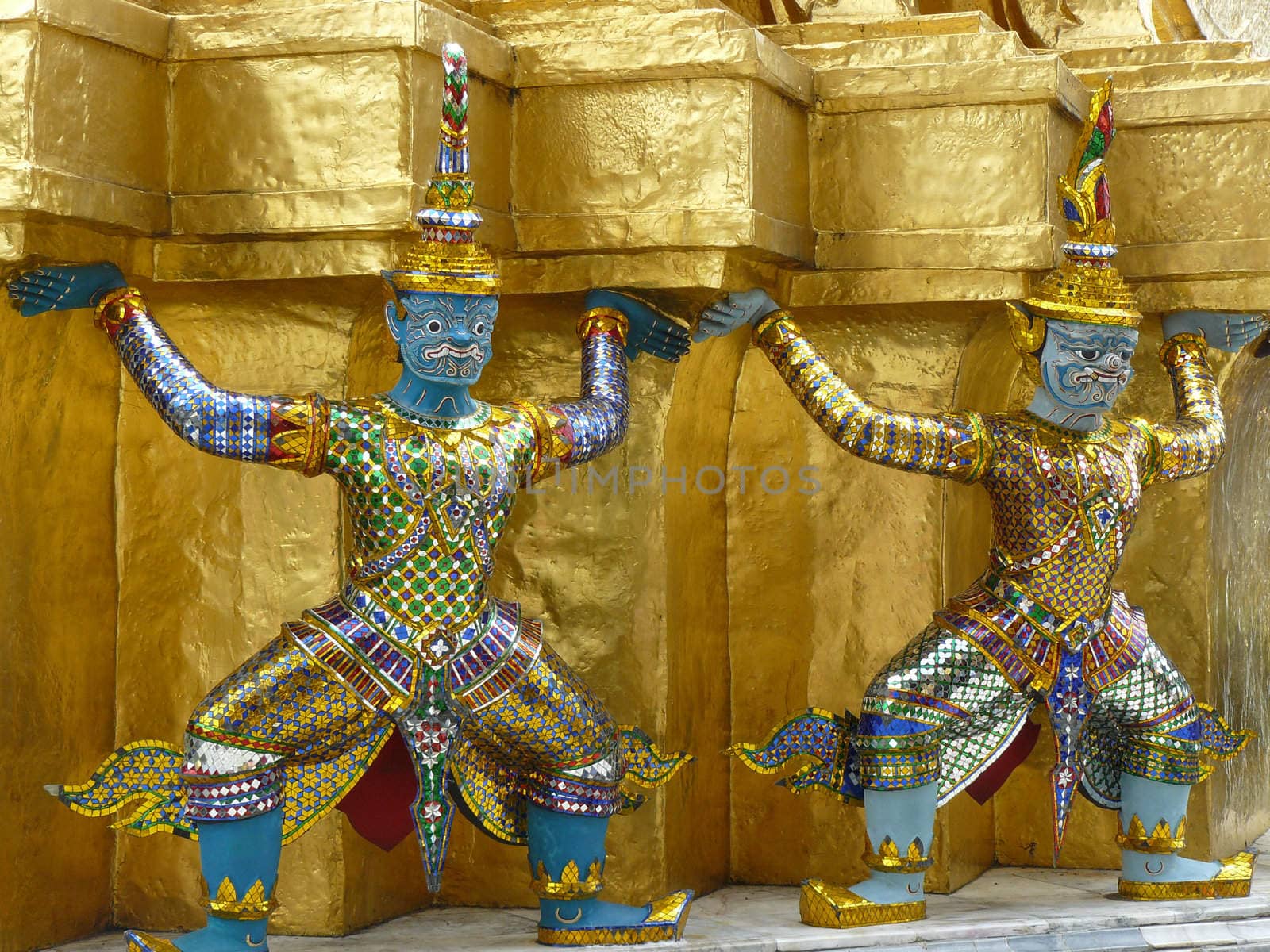 Statue of demon guardians at the Buddhist temple of Wat Phra Kaeo at the Grand Palance in Bangkok, Thailand.
