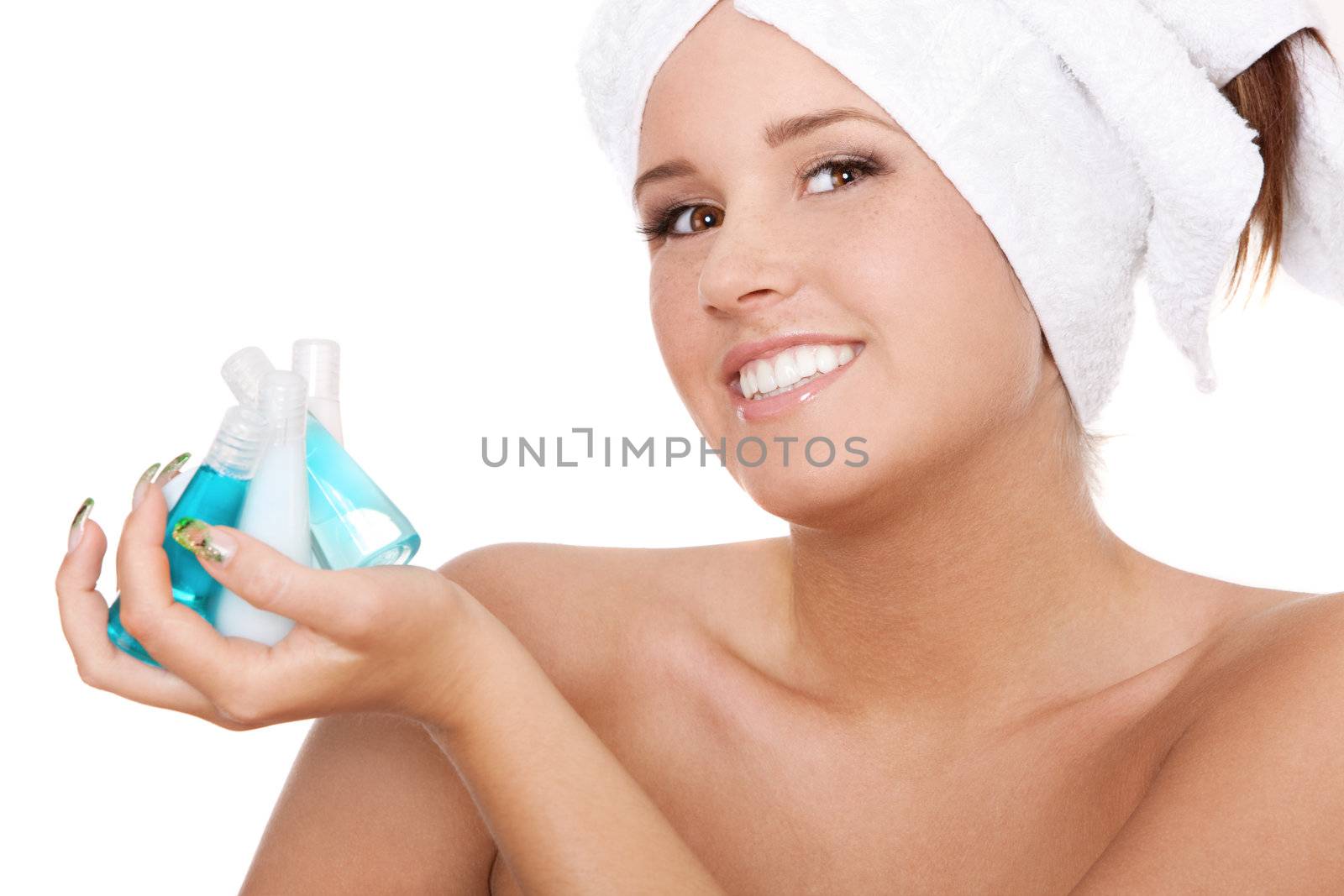 Spa woman holding bottles with shampoo