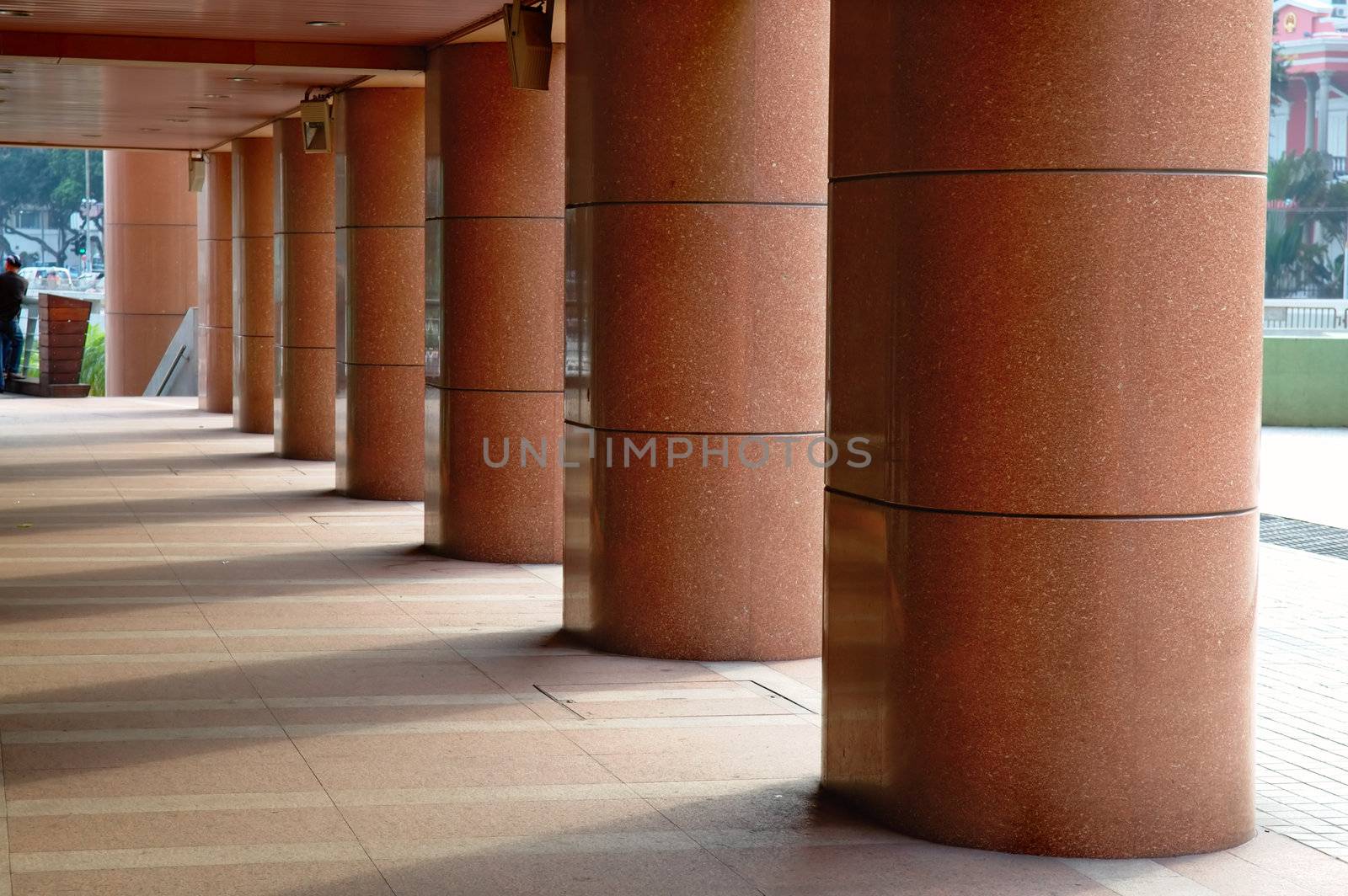 A perspecitive view of walkway with poles