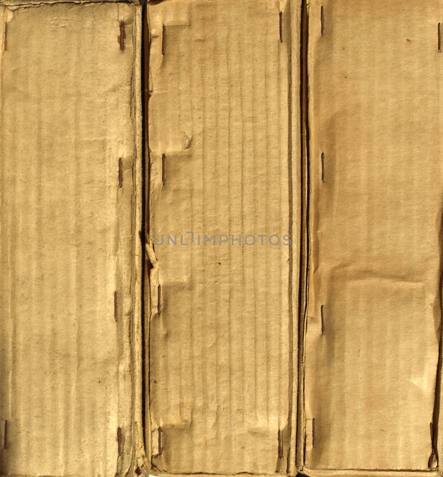 Brown grunge corrugated cardboard sheet useful as a background