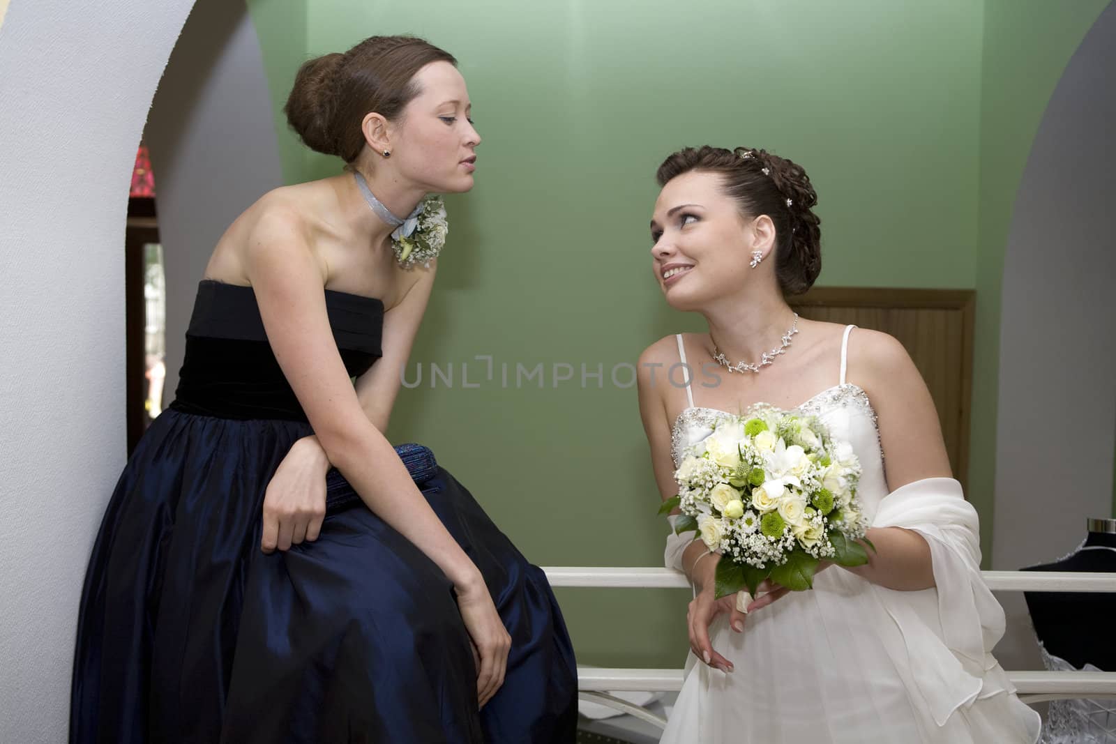 bride with maid of honour talking