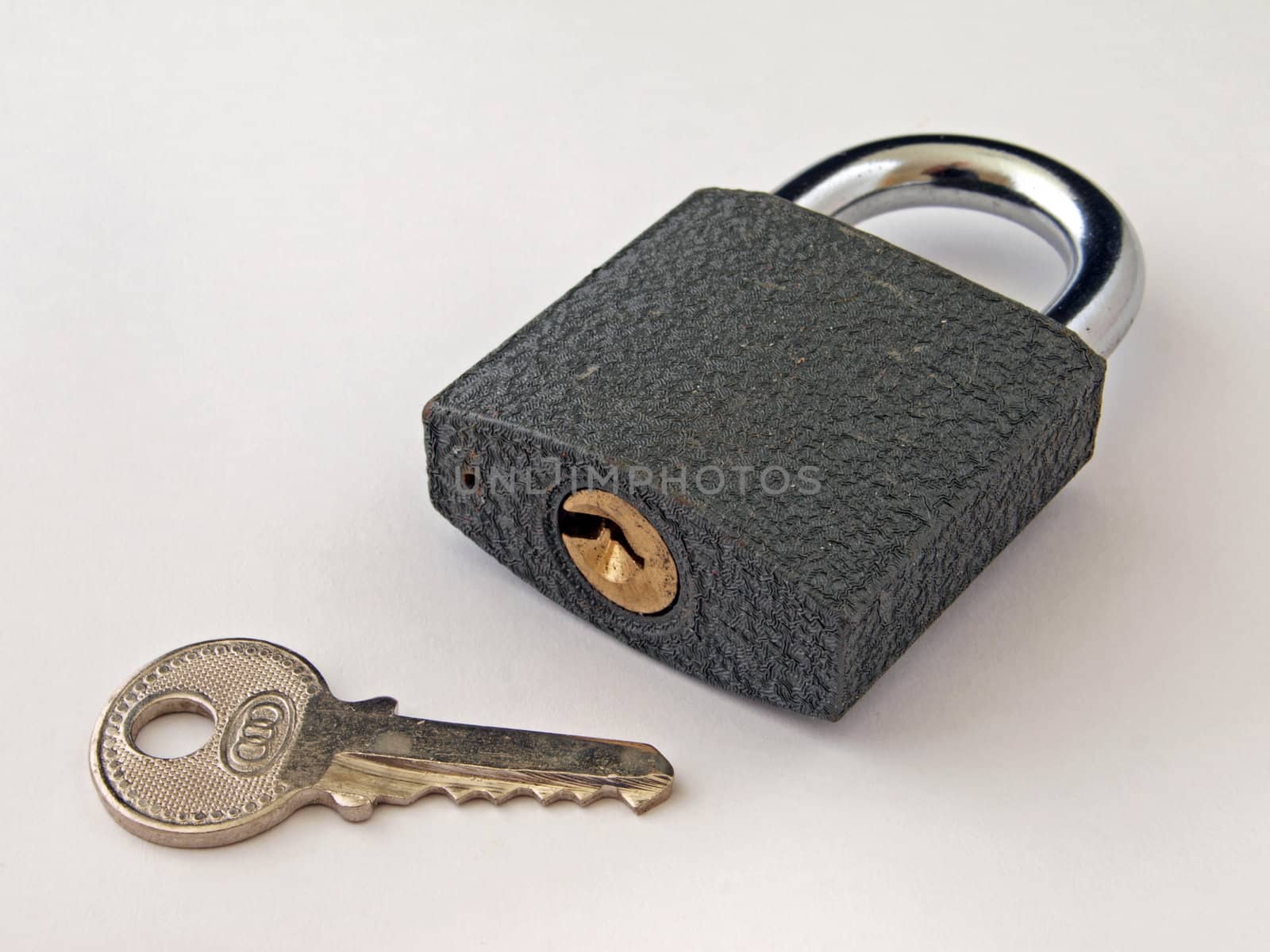 Padlock in the closed position and a key. 