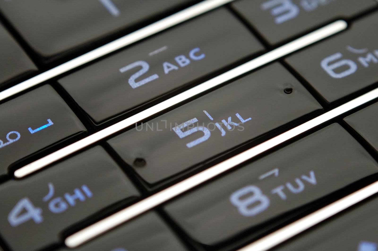 A close up shot of mobile keypad under light