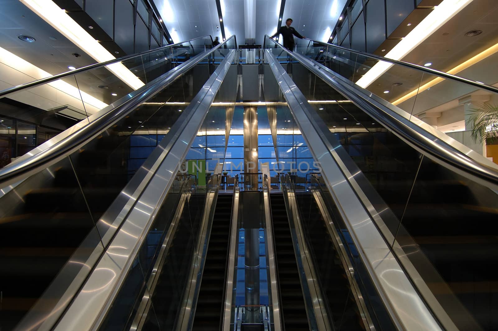 Motion of people with escalators in terminal of airport