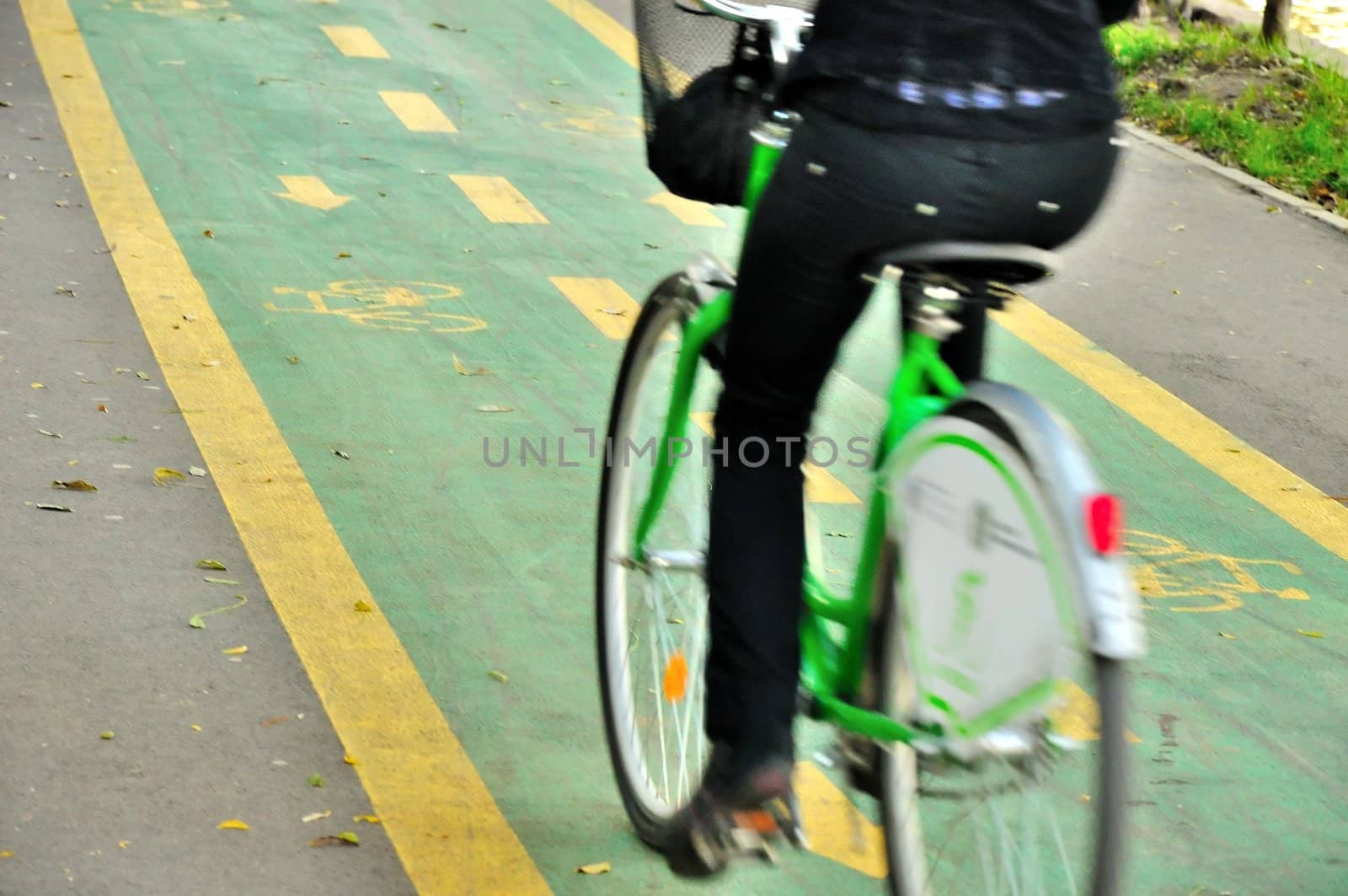 Woman biker on the bicycle track