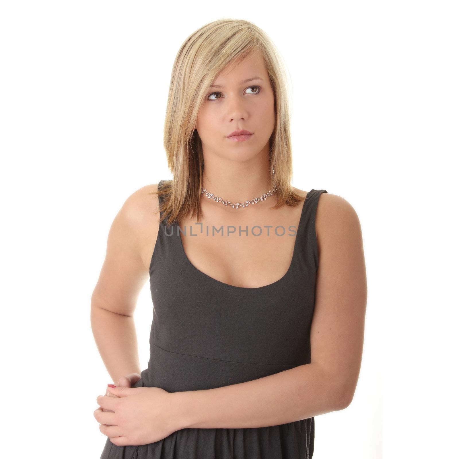 Beautiful teenager young blond girl in black elegant dress isolated on white background