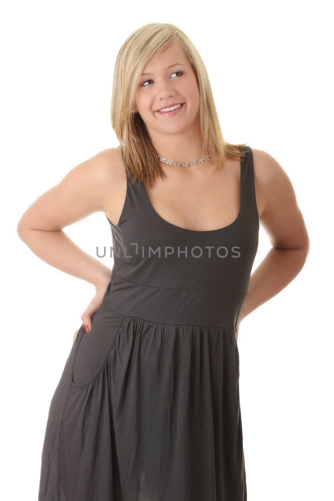 Beautiful teenager young blond girl in black elegant dress isolated on white background