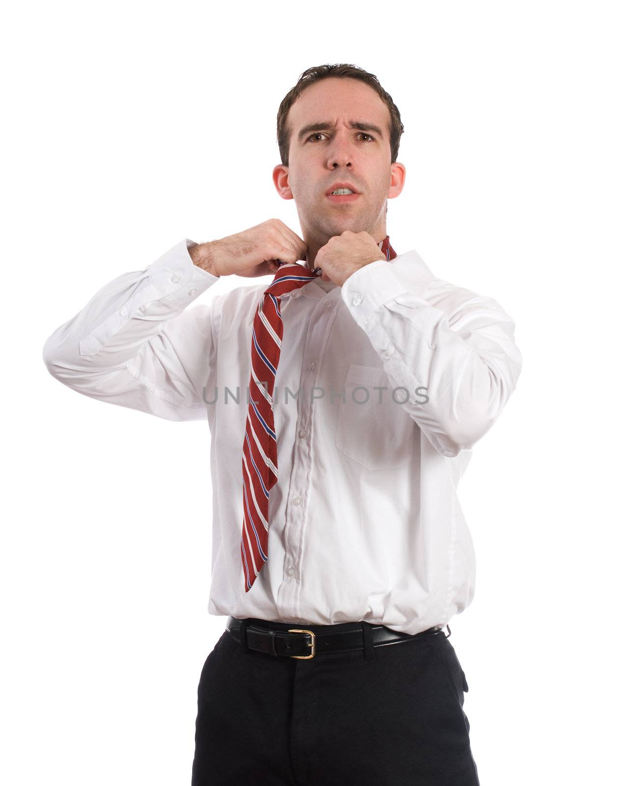 A frustrated businessman loosening his tie, isolated against a white background