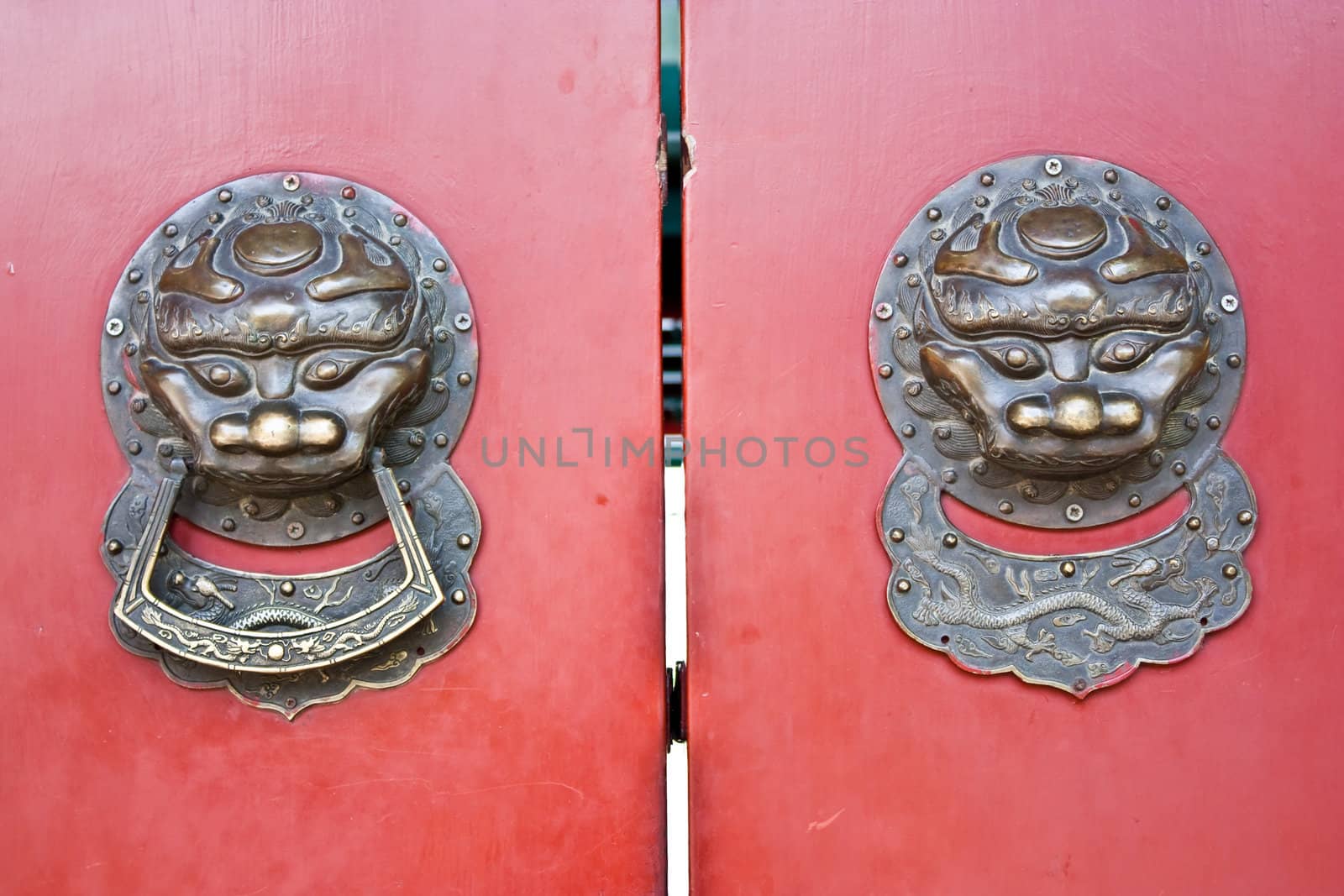 Red door in hutong area, close to Forbidden City, Beijing, China