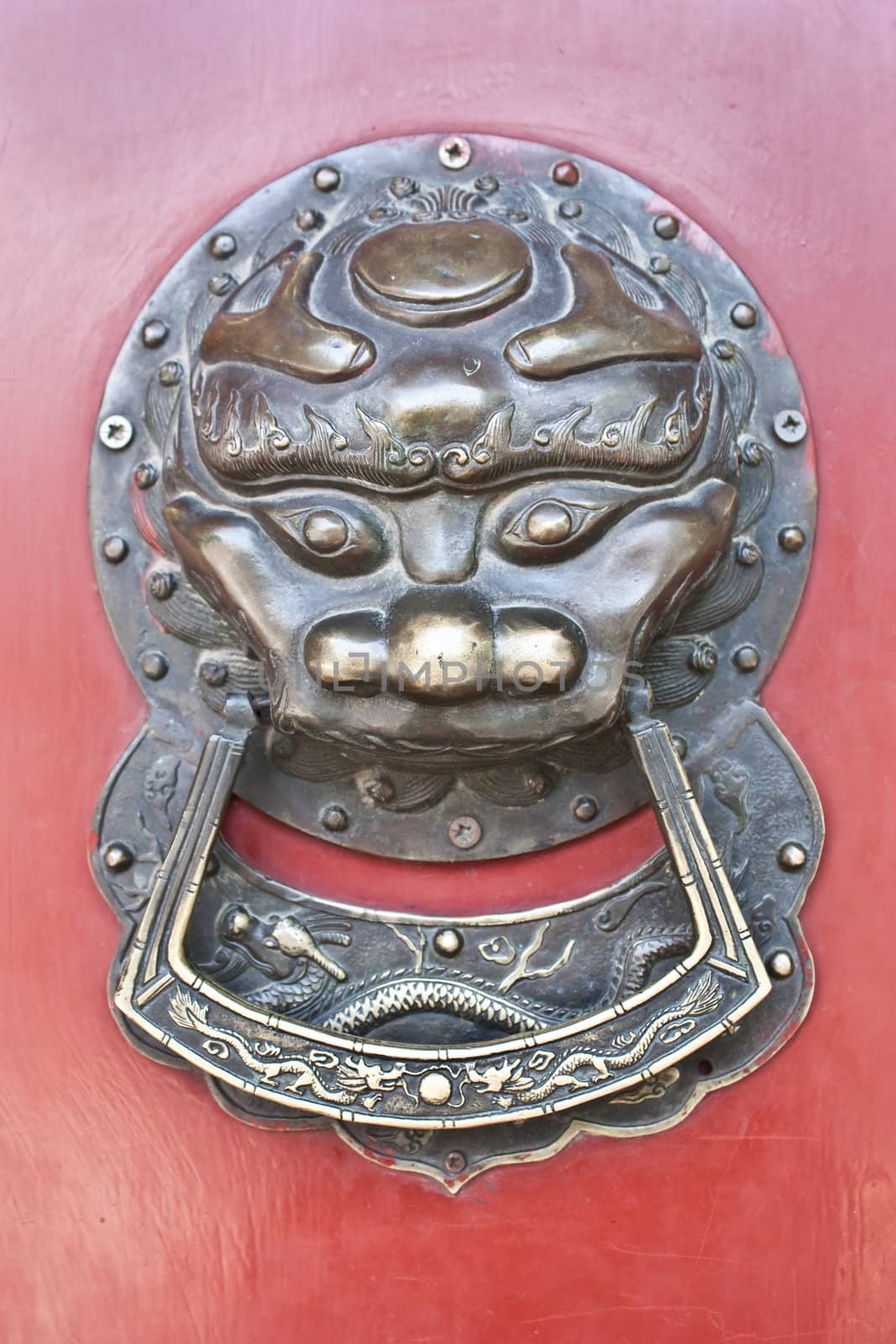 Red door in hutong area, close to Forbidden City, Beijing, China