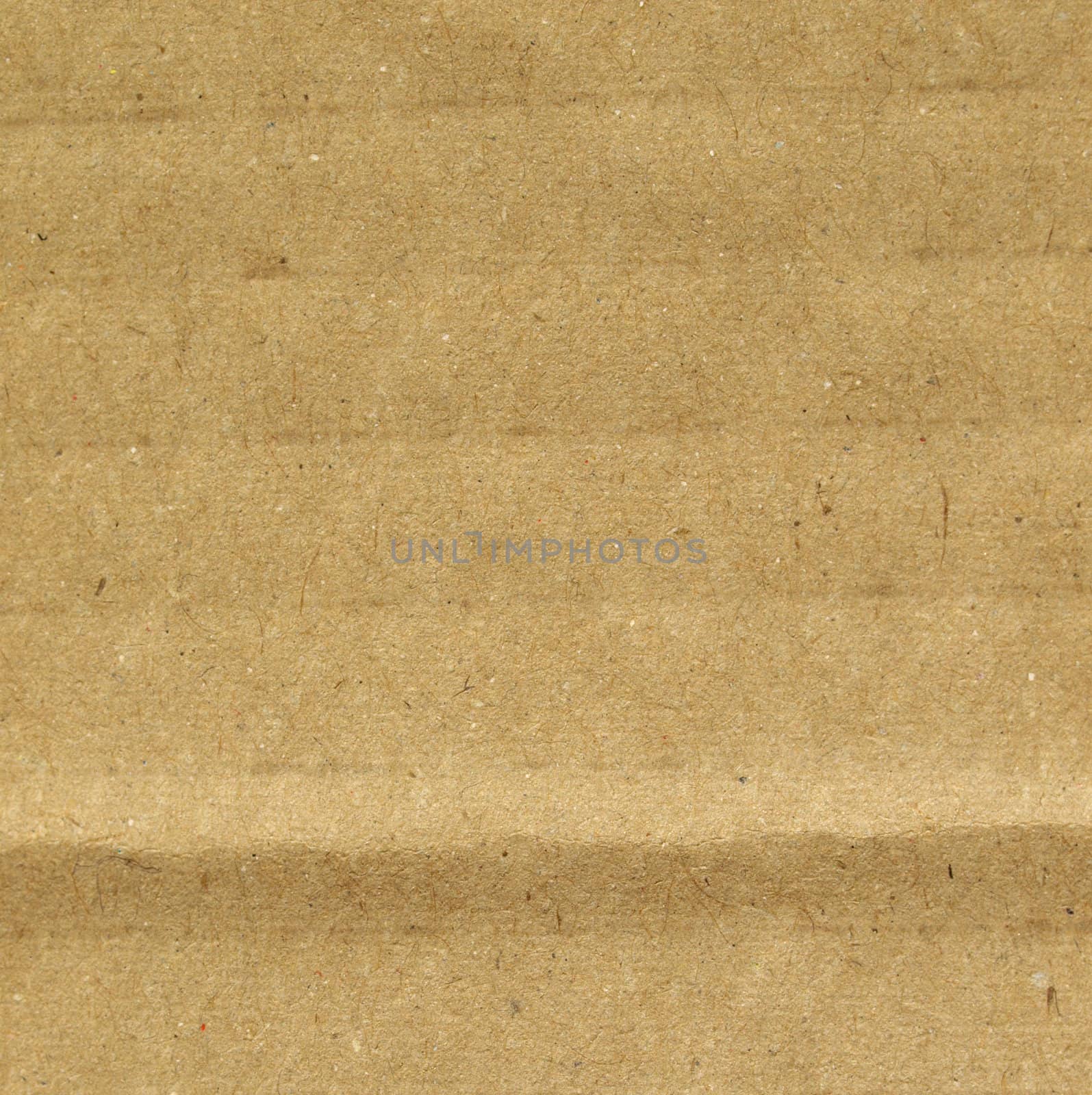 Brown grunge corrugated cardboard sheet useful as a background