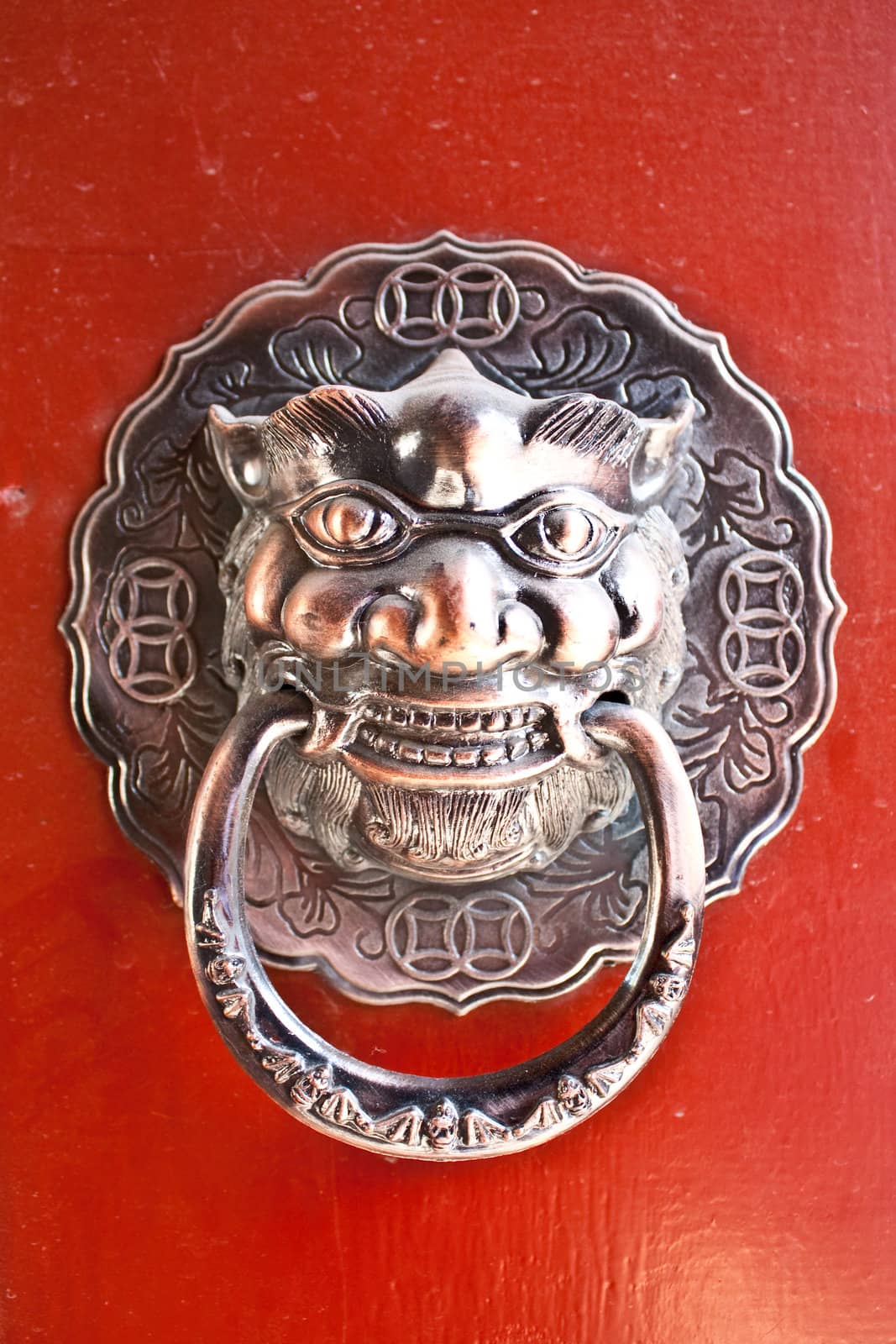 Red door in hutong area, close to Forbidden City, Beijing, China