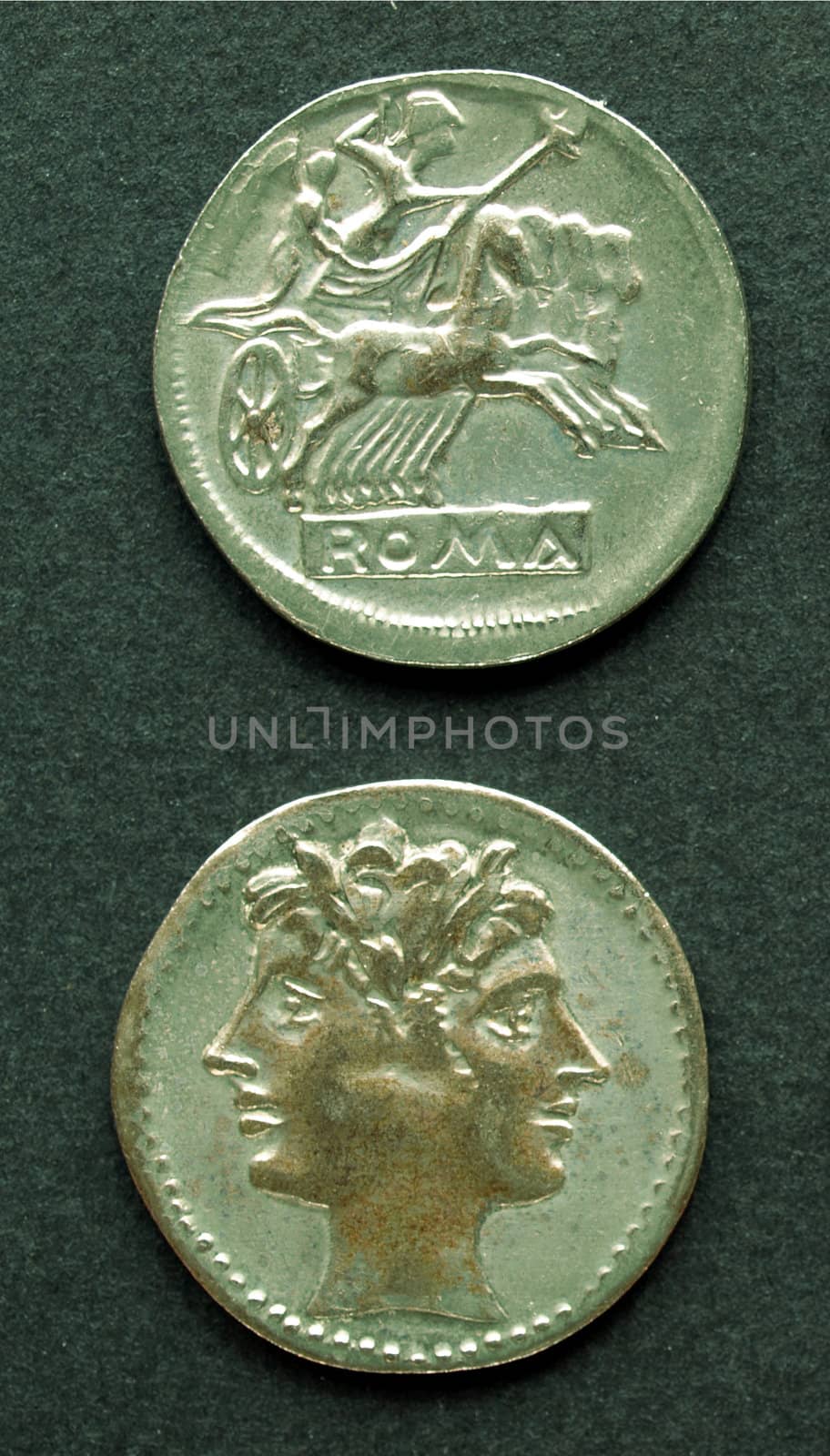 Ancient Roman coin on a black background