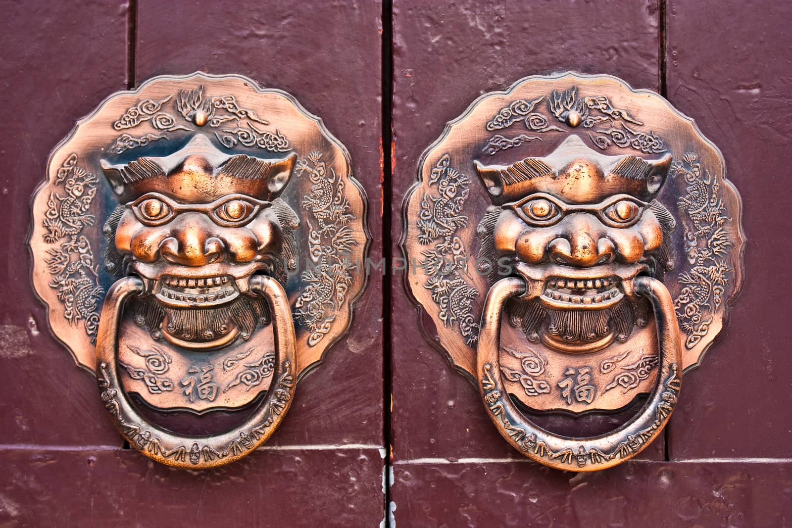 Red door in hutong area, close to Forbidden City, Beijing, China