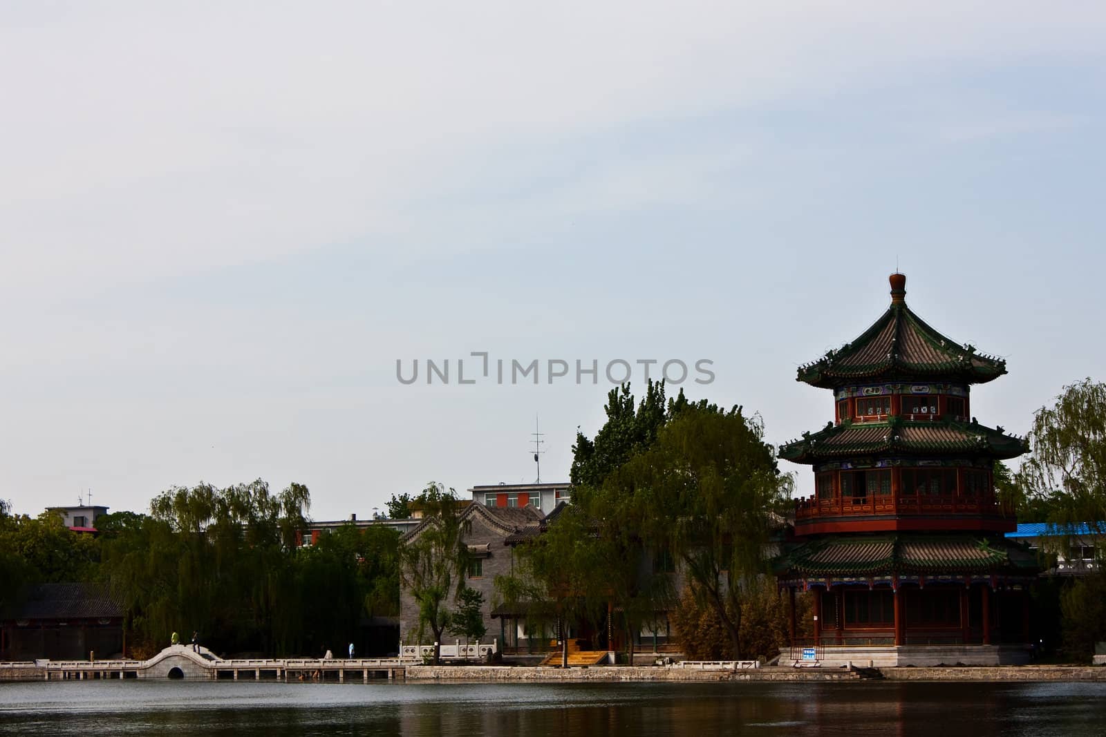 View of lake and ancient tower in Beijing, close to Forbidden City