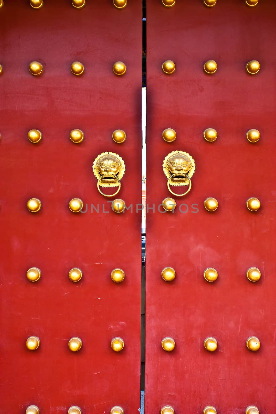 Red door in hutong area, close to Forbidden City, Beijing, China