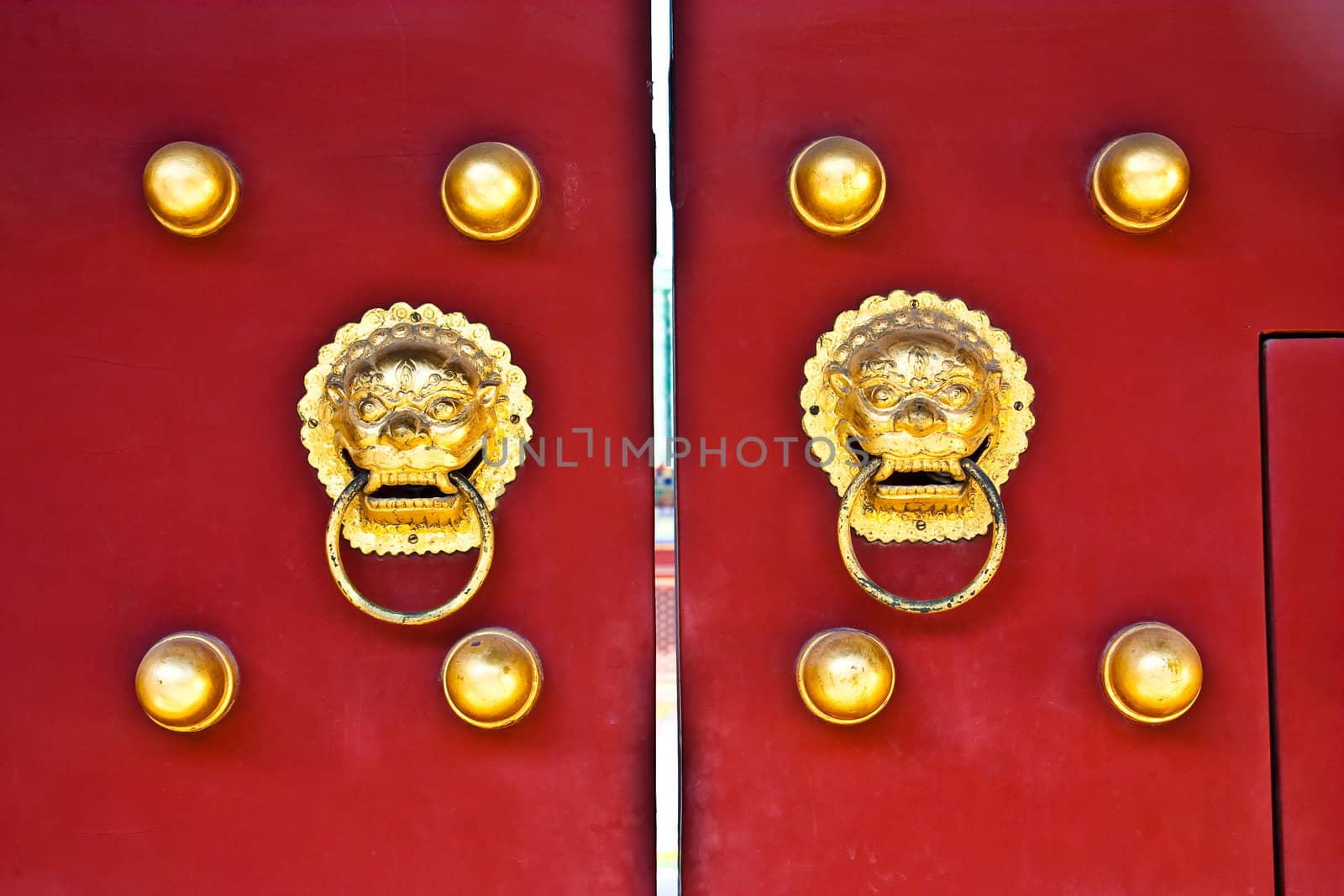 Red door in hutong area, close to Forbidden City, Beijing, China