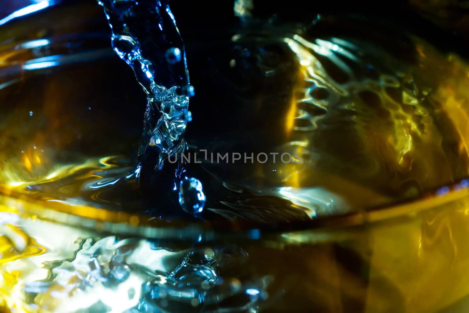 splash on clear glass with colored light by keko64