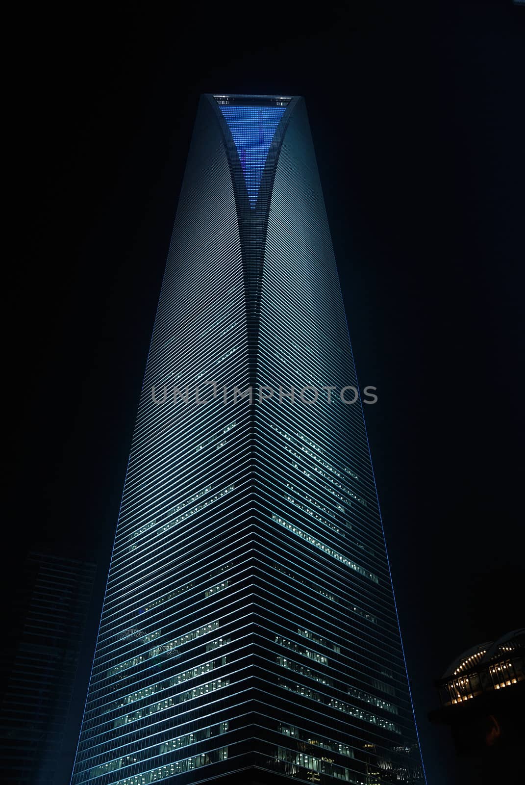 shanghai pudong world financial center and jin mao tower illuminated by night