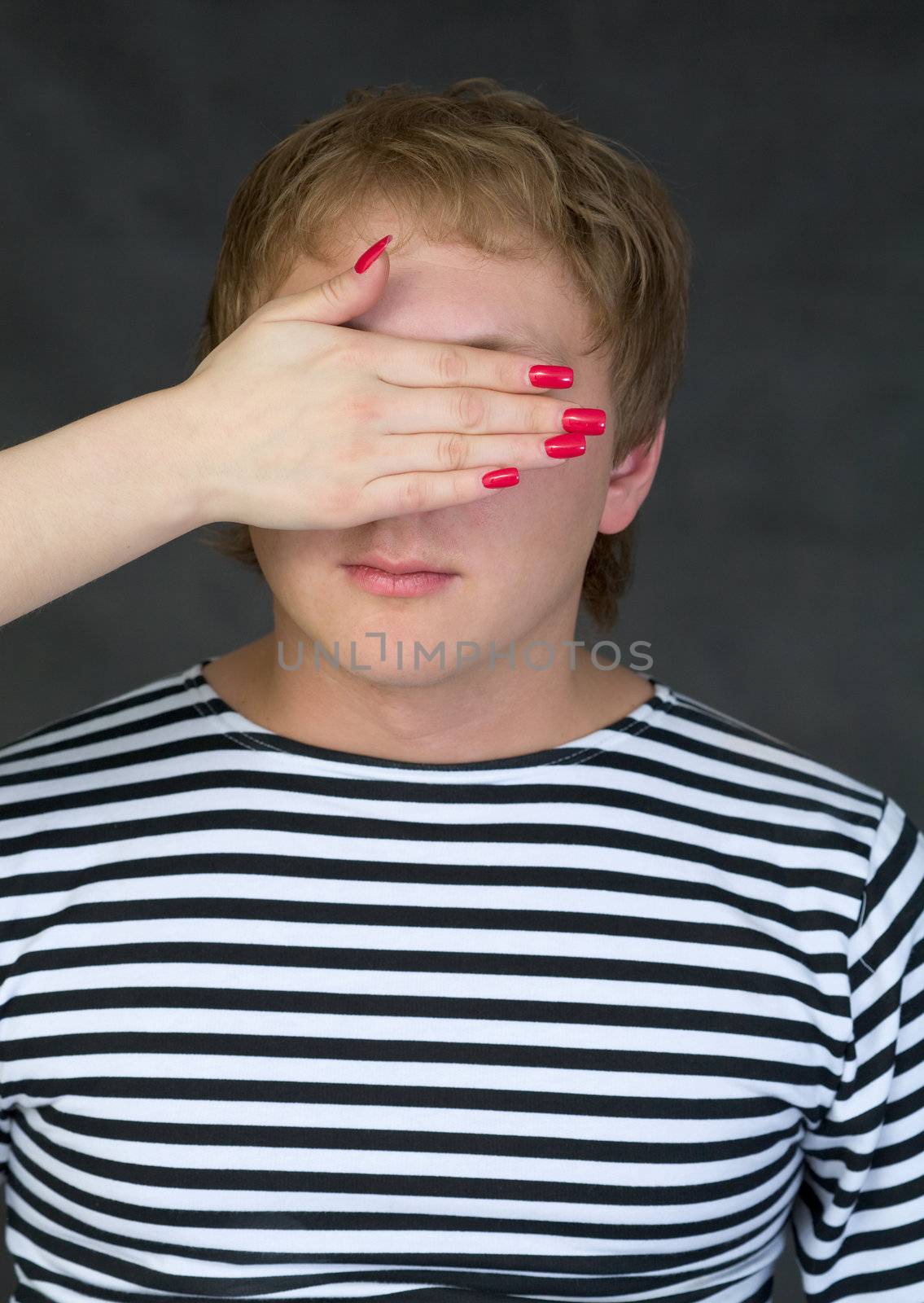 Male portrait with closed eye for female palm