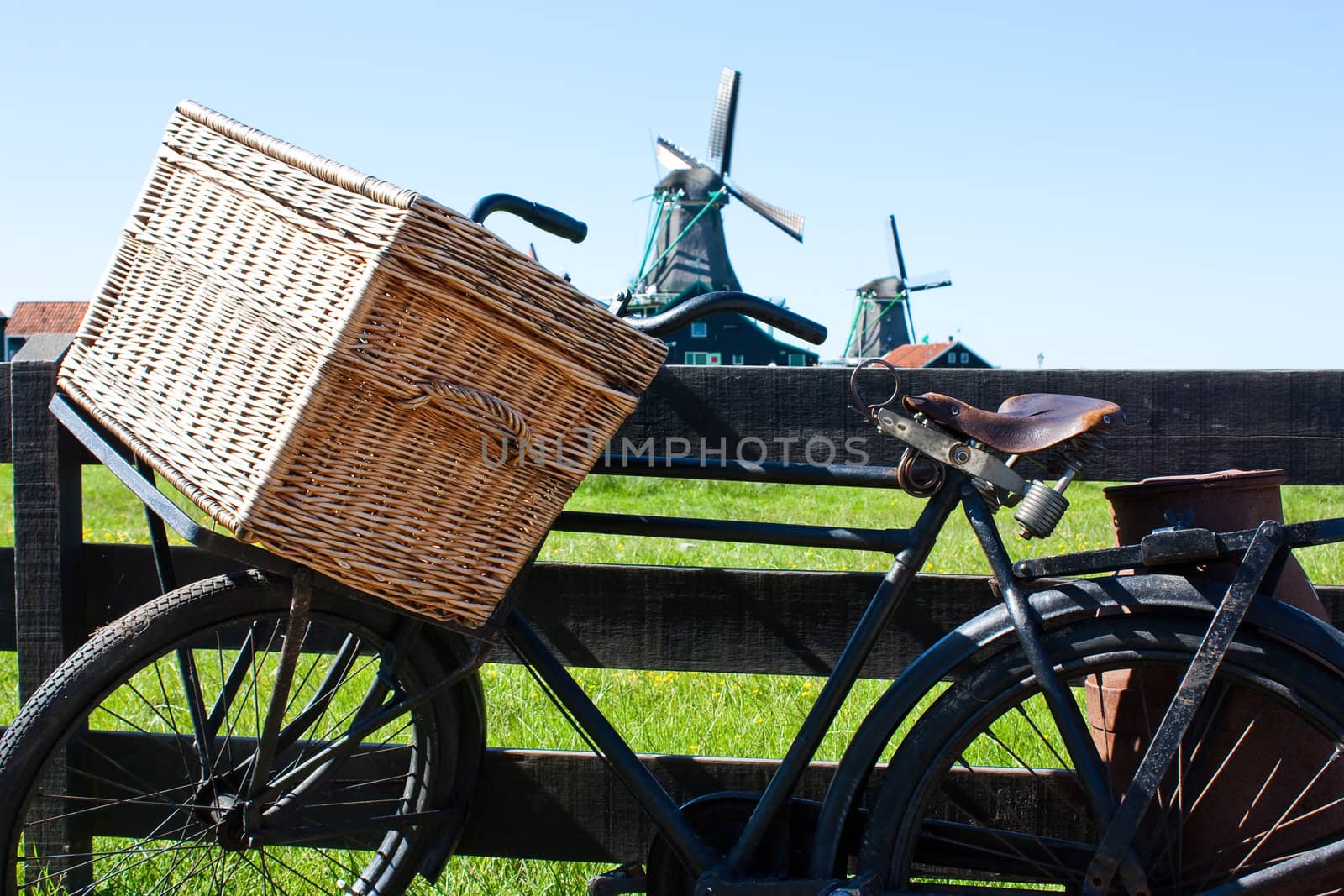 Clear and traditional landmark for Holland: bicycle and mills