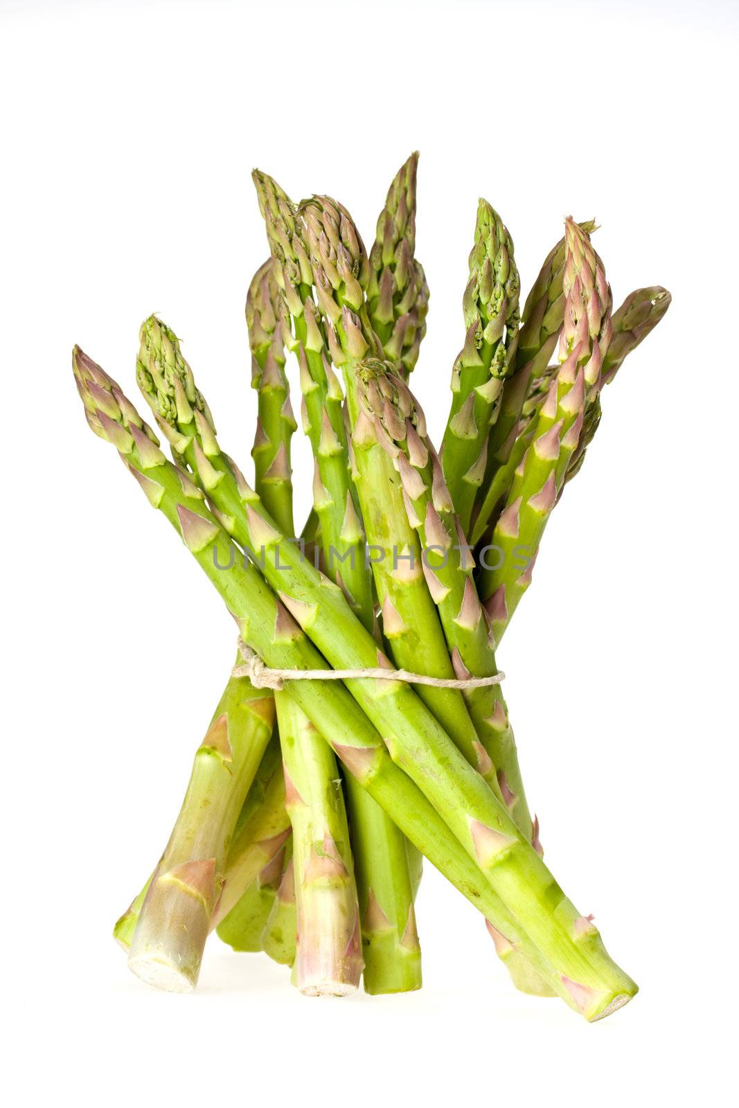 detail of fresh green asparagus isolated on white background by bernjuer