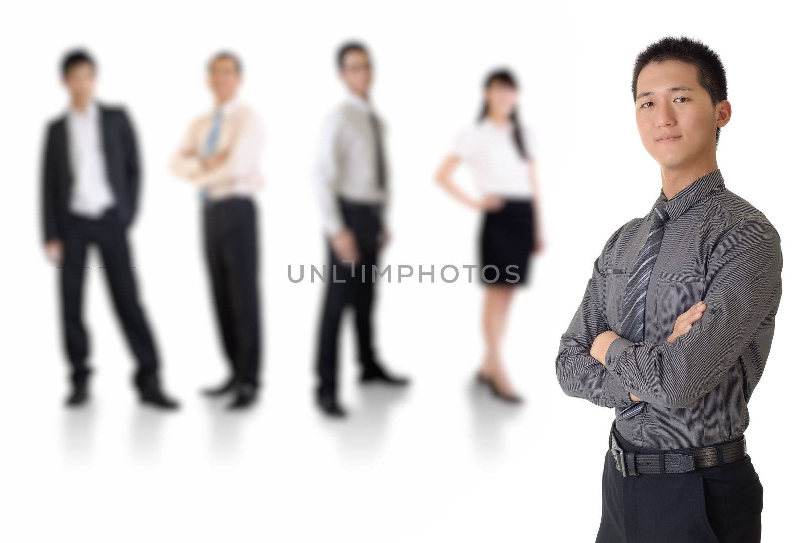 Young business man with his team over white background.