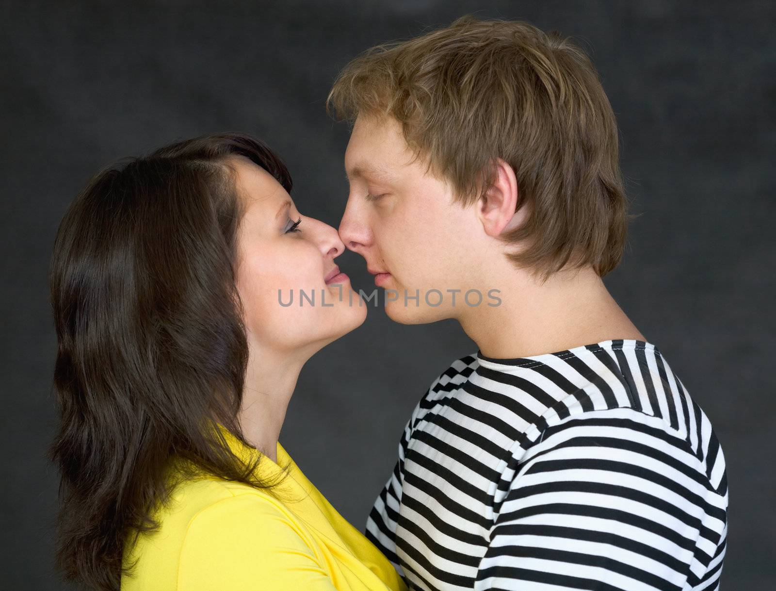  Loving couple on the black background