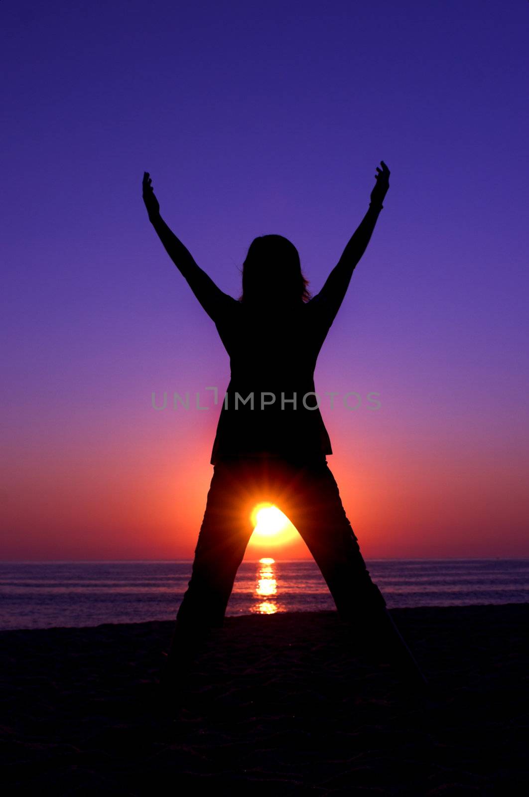 Woman silhouette at the sunset on a beautiful end of the day