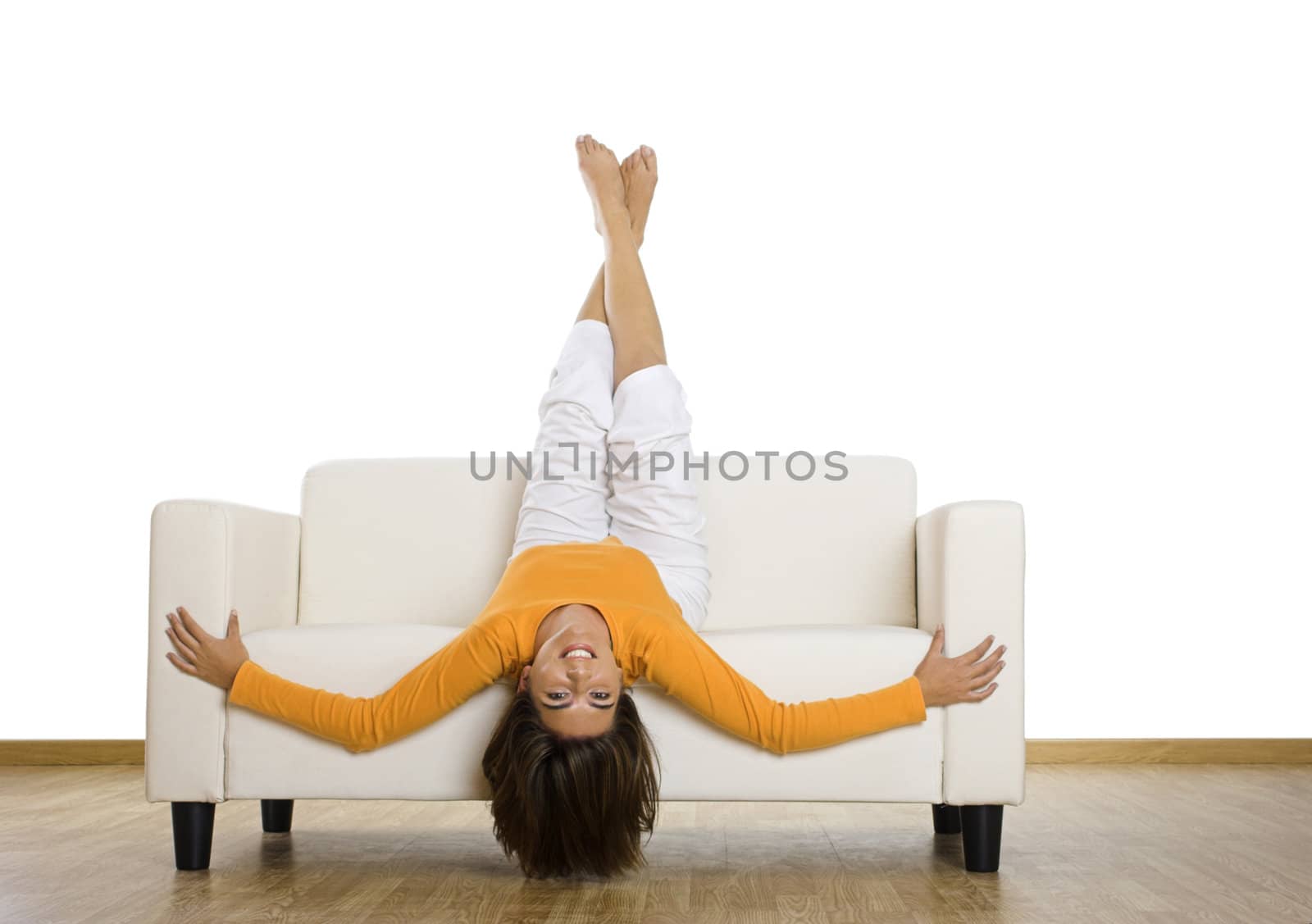 Beautiful woman laughing on the couch at home