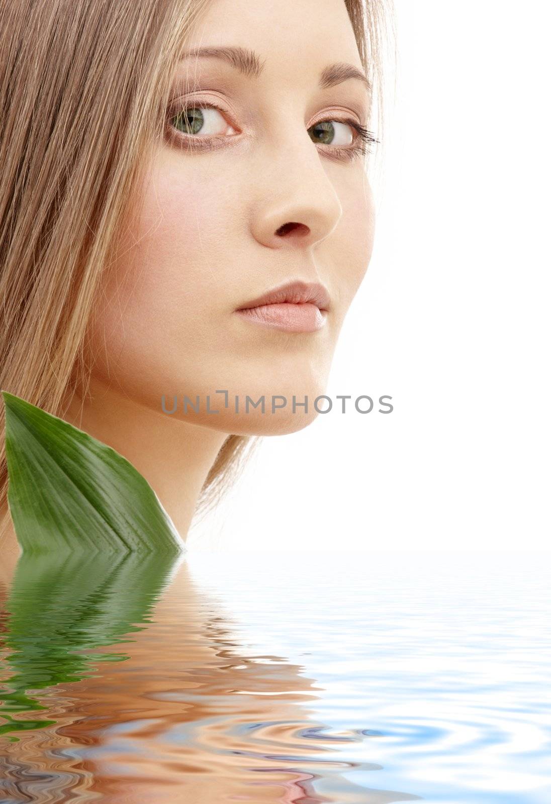 bright picture of lovely woman with green leaf in water