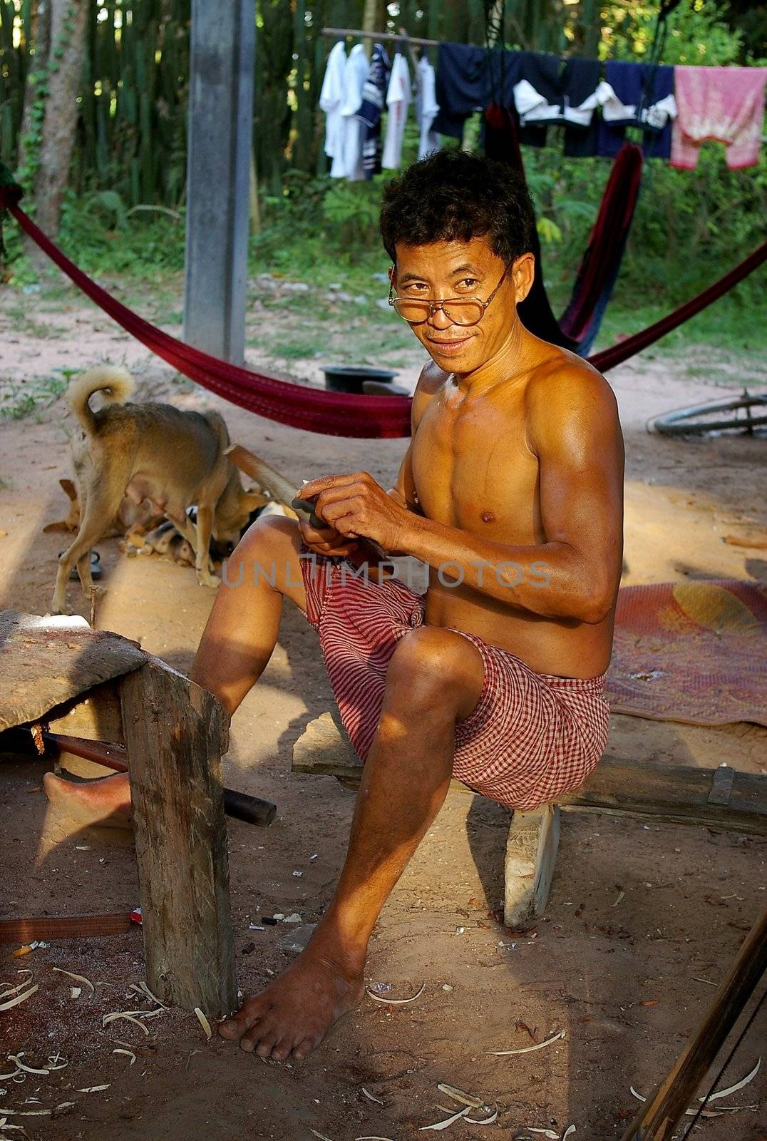 Portrait of a craftsman making souvenirs to sell at Angkor Wat, Cambodia.
