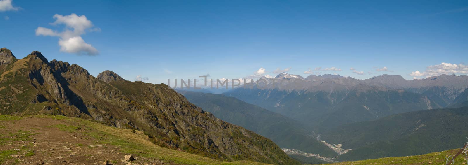 Aerial view of Krasnaya Poluana place (Sochi, Russia) from the top of Aibga Peak. The resort is slated to host the snow events (alpine and nordic) of the 2014 Winter Olympics in Sochi. Panoramic image stitched from 5 vertical shots.