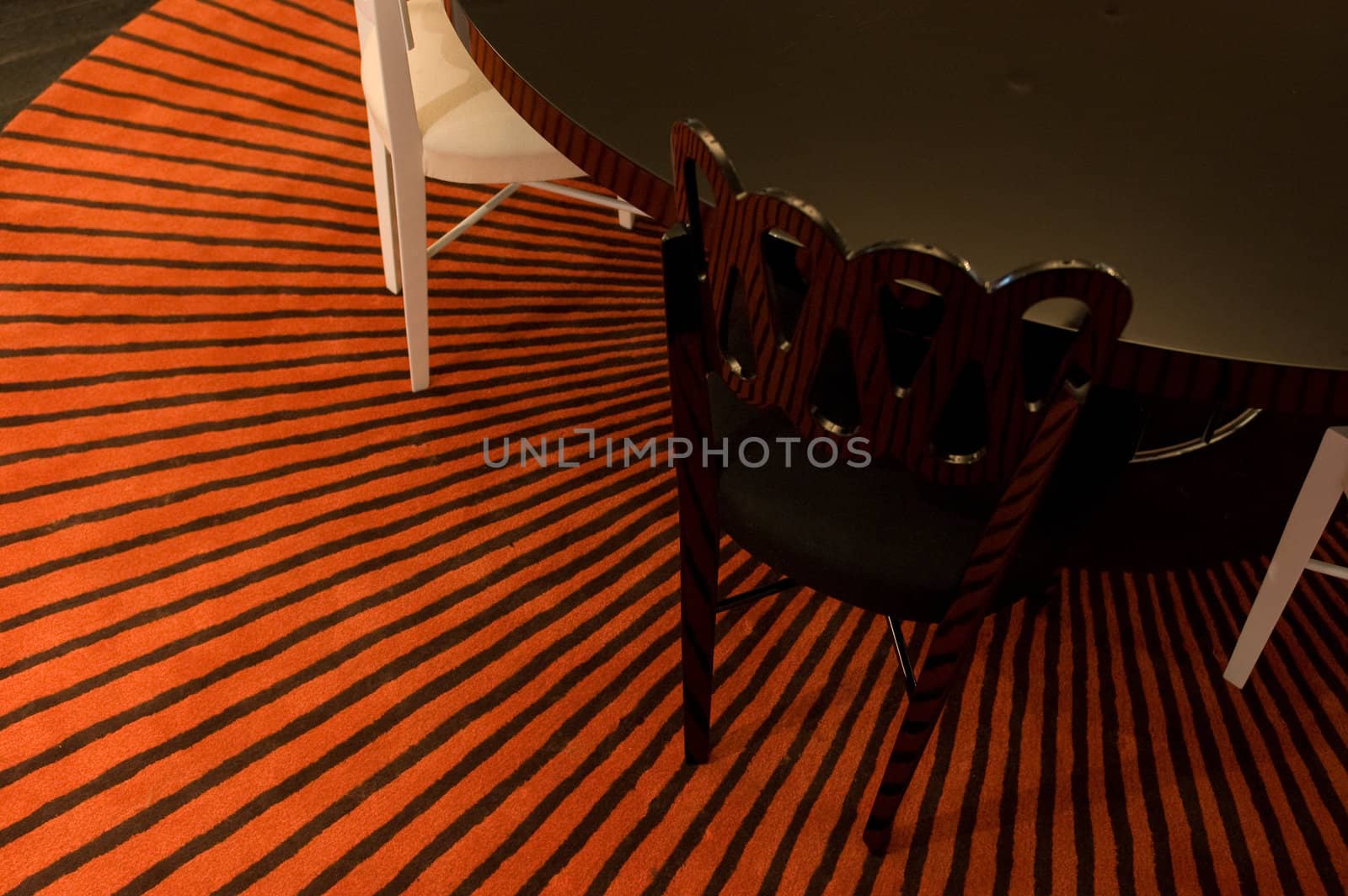 stripped rug with table and chairs