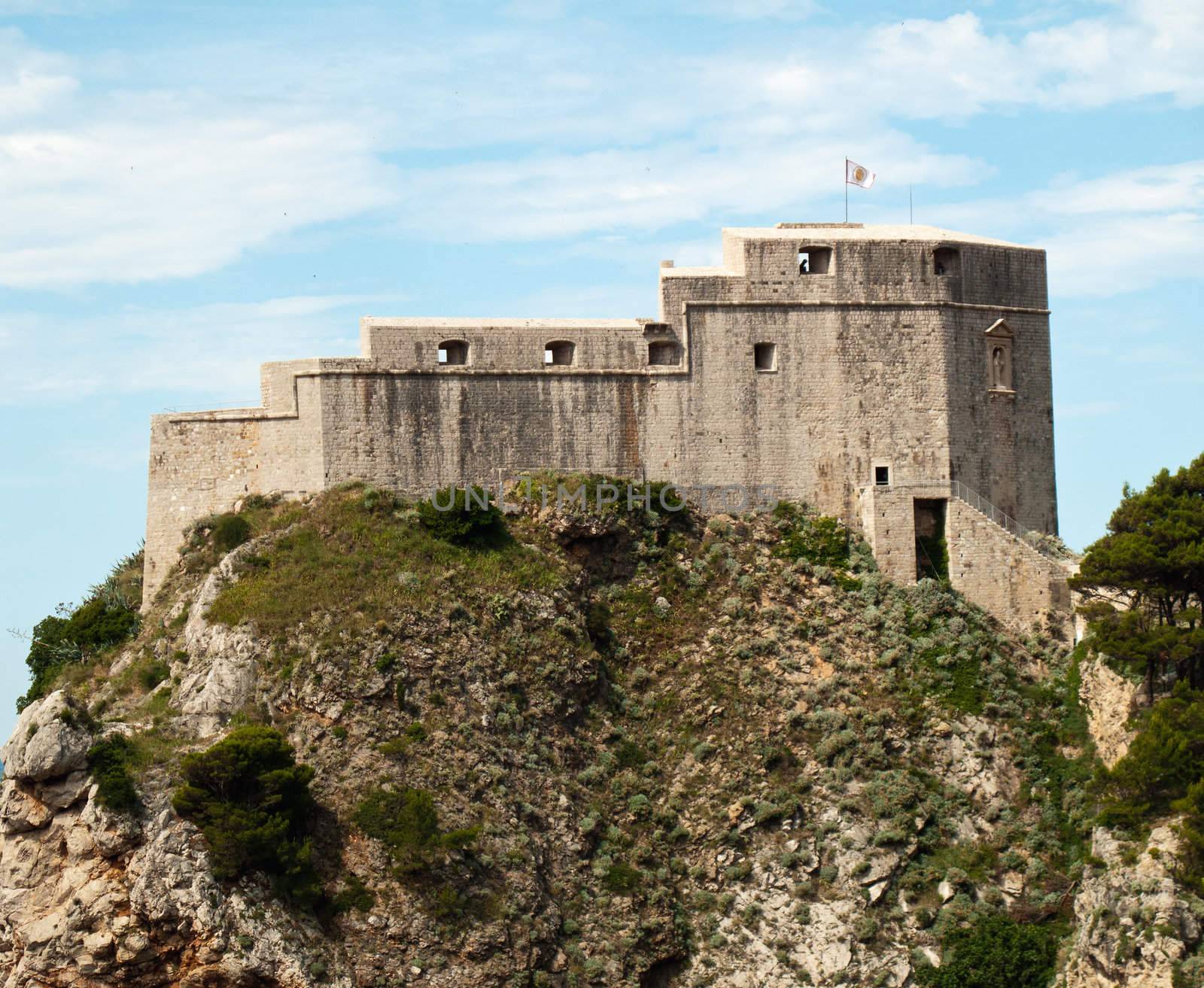 Ancient fortress on the cliff edge of Dubrovnik protects the port