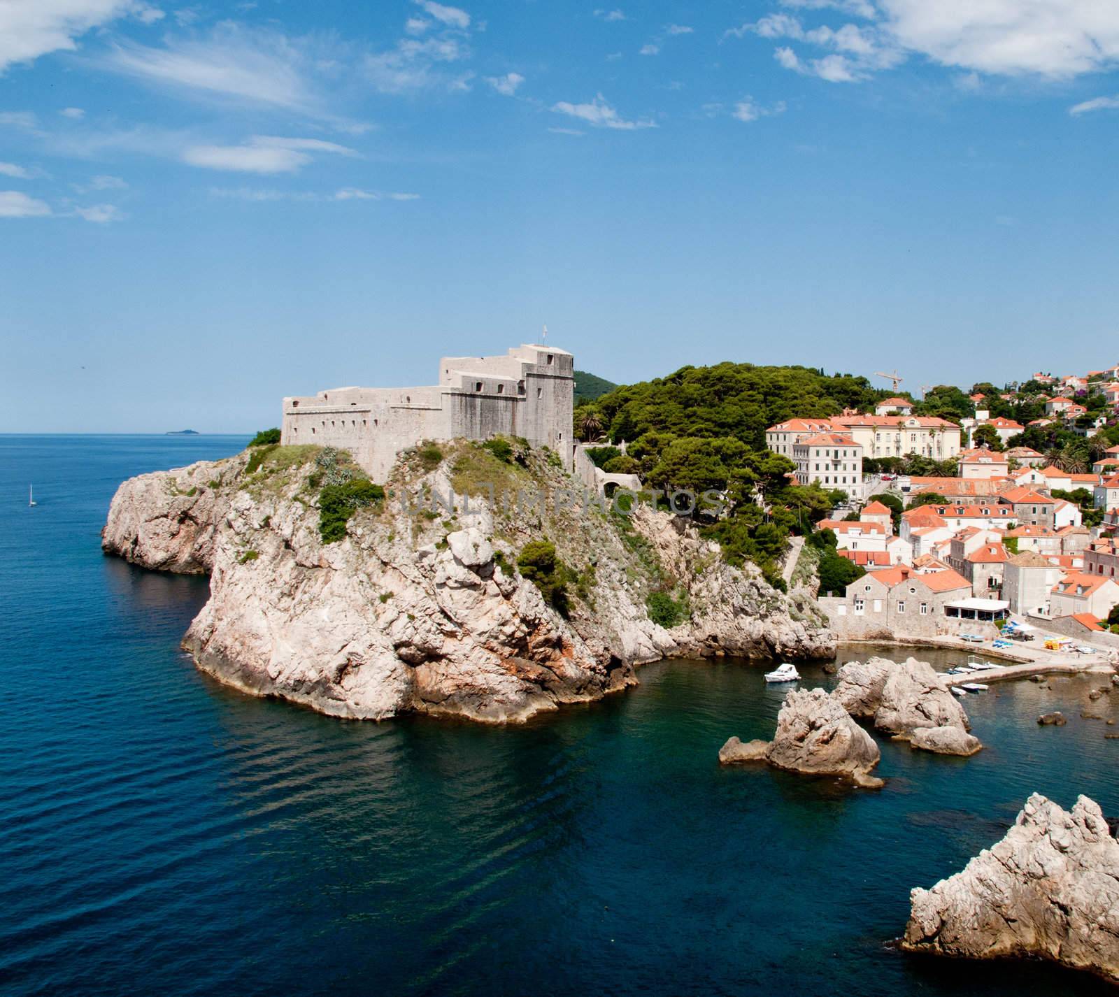 Ancient fortress on the cliff edge of Dubrovnik protects the port