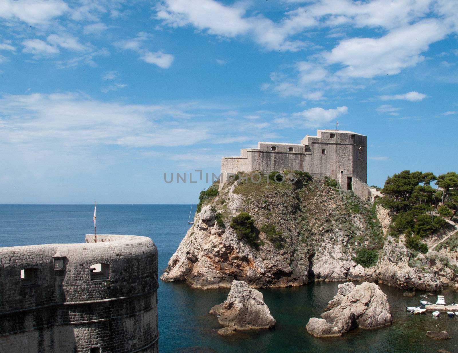 Ancient fortress on the cliff edge of Dubrovnik protects the port