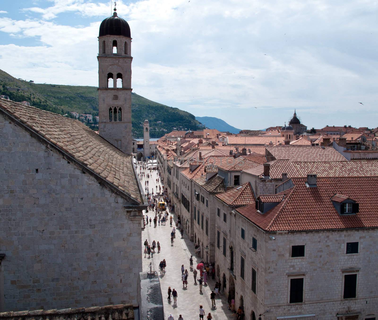 View down main street of Dubrovnik to tower and distant ocean