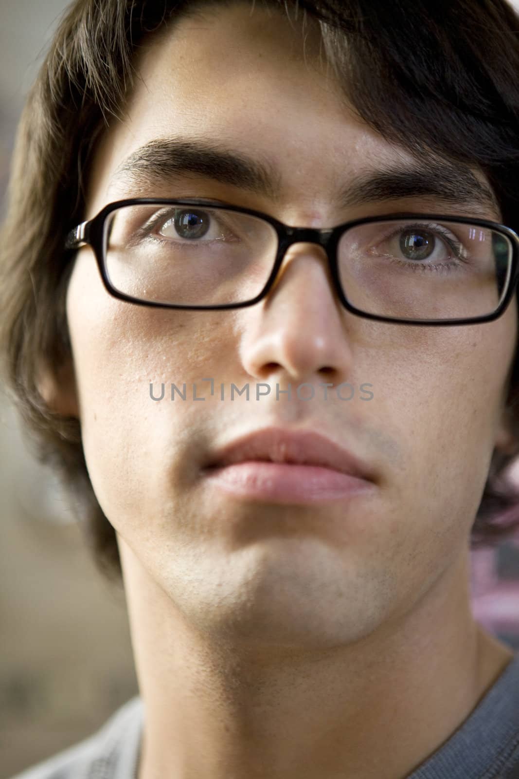 close up portrait of young serious handsome man.
