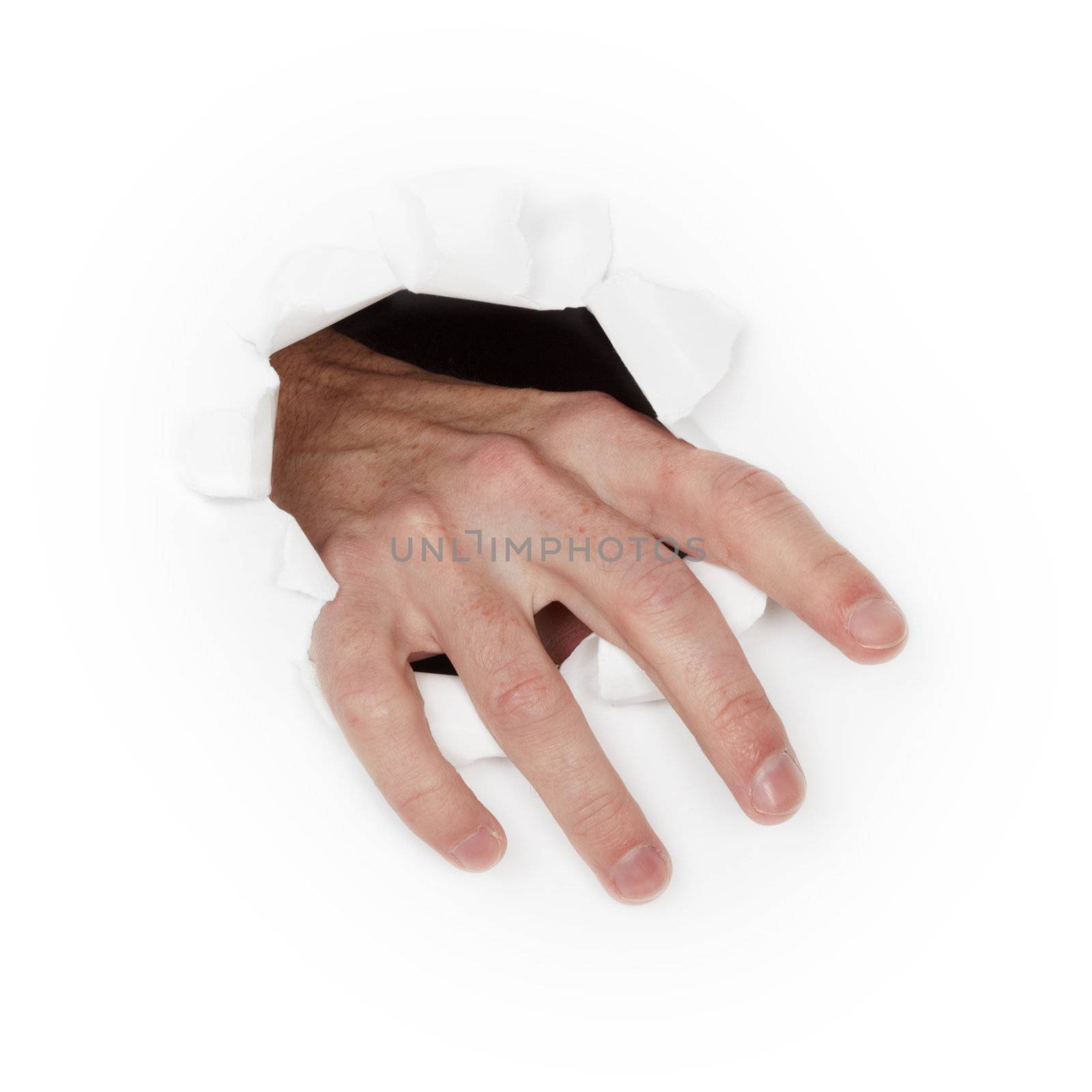 Man's hand breaks through the white paper