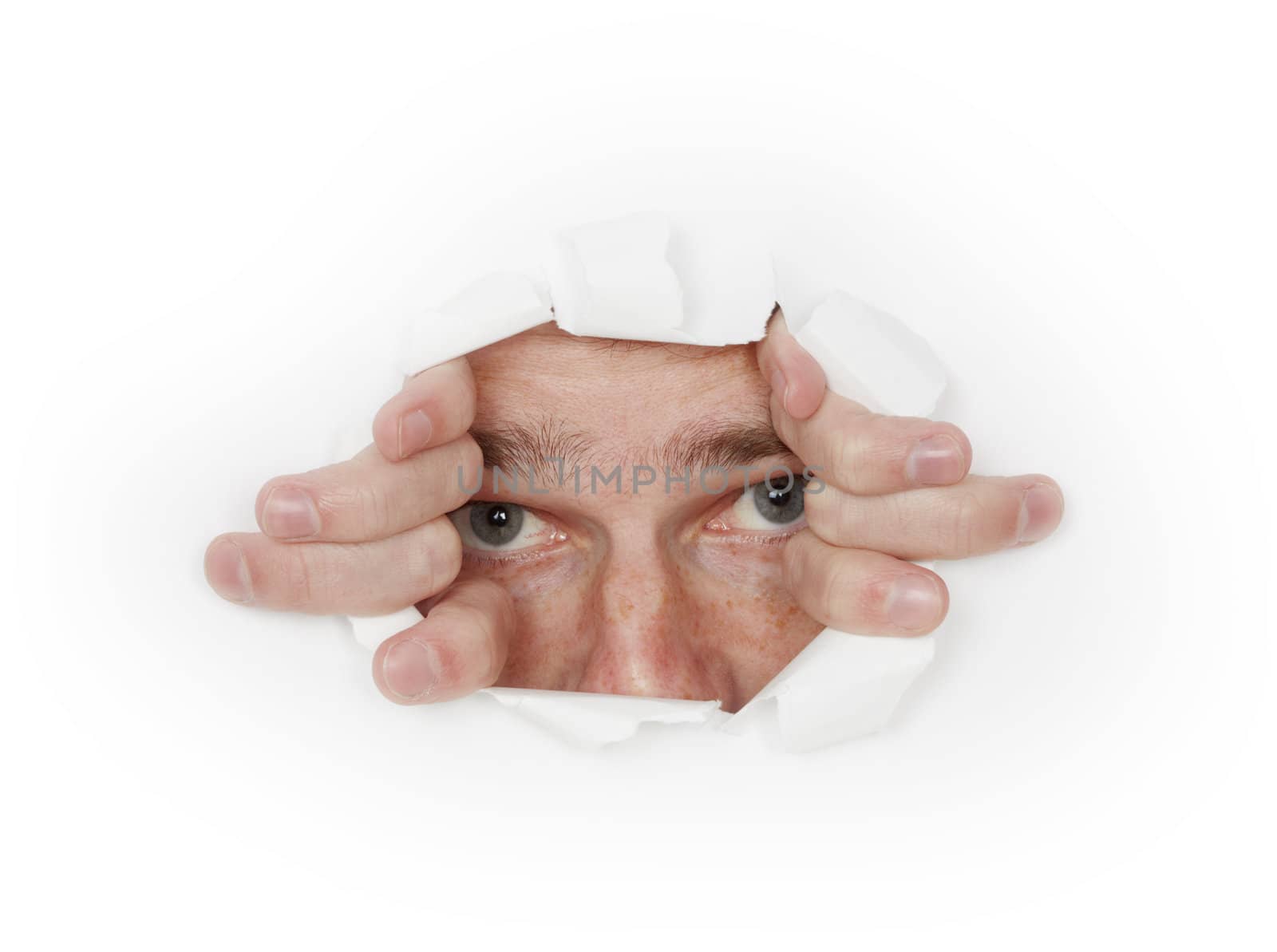 A man looks out from a hole in the white paper