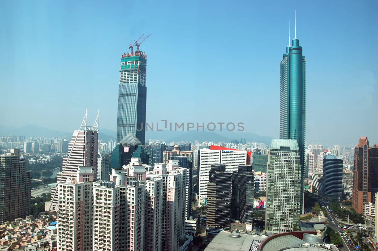 SHENZHEN, CHINA - OCTOBER 31: Two, highest skyscrapers in Shenzhen on October 31, 2010. Shun Hing Square, named also as DiWang - 384 meters and Kingkey Finance Tower � 441 meters, still under construction.