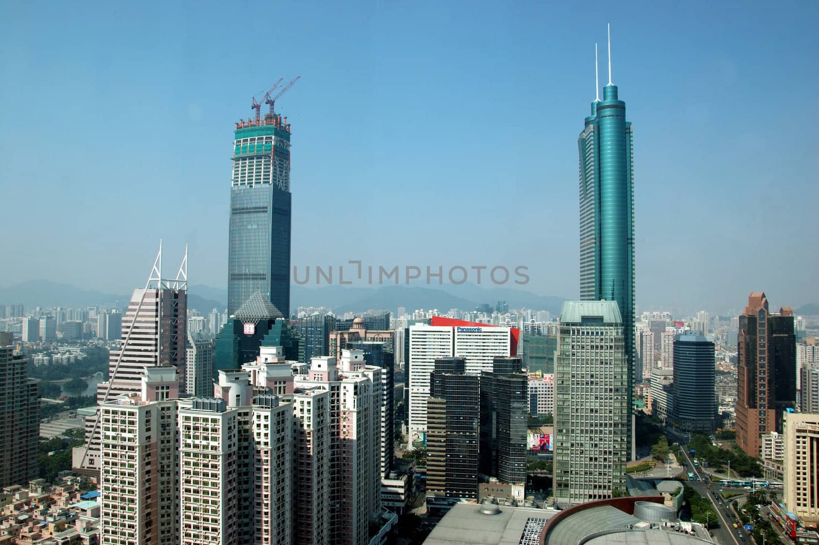 SHENZHEN, CHINA - OCTOBER 31: Two, highest skyscrapers in Shenzhen on October 31, 2010. Shun Hing Square, named also as DiWang - 384 meters and Kingkey Finance Tower � 441 meters, still under construction.