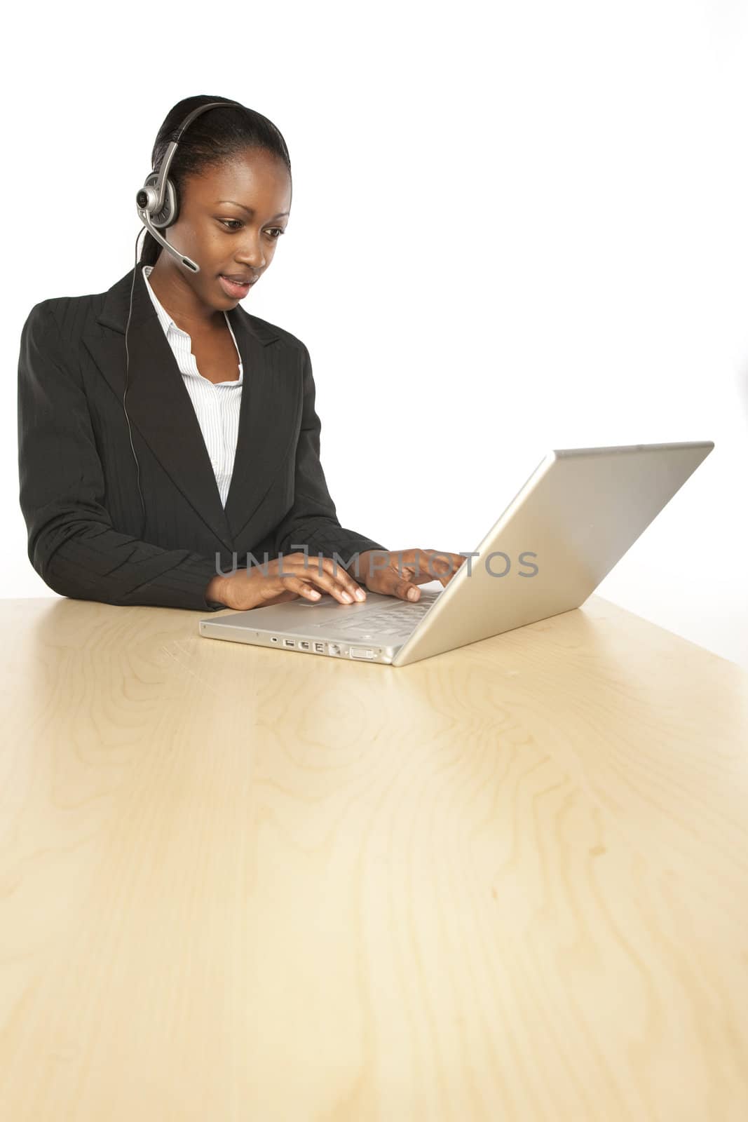 Smiling customer service operator.Female black girl with the headphones